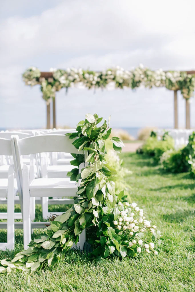 aboutdetailsdetails.com | Brandon Kidd | LA Wedding Planner | Catalina Point Wedding | Wedding Ceremony Inspiration | Ocean Backdrop | Textured Garlands | Garland Lined Wedding Aisle | Greenery with White Flowers