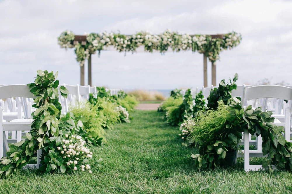 aboutdetailsdetails.com | Brandon Kidd | LA Wedding Planner | Catalina Point Wedding | Wedding Ceremony Inspiration | Ocean Backdrop | Textured Garlands | Garland Lined Wedding Aisle | Greenery with White Flowers