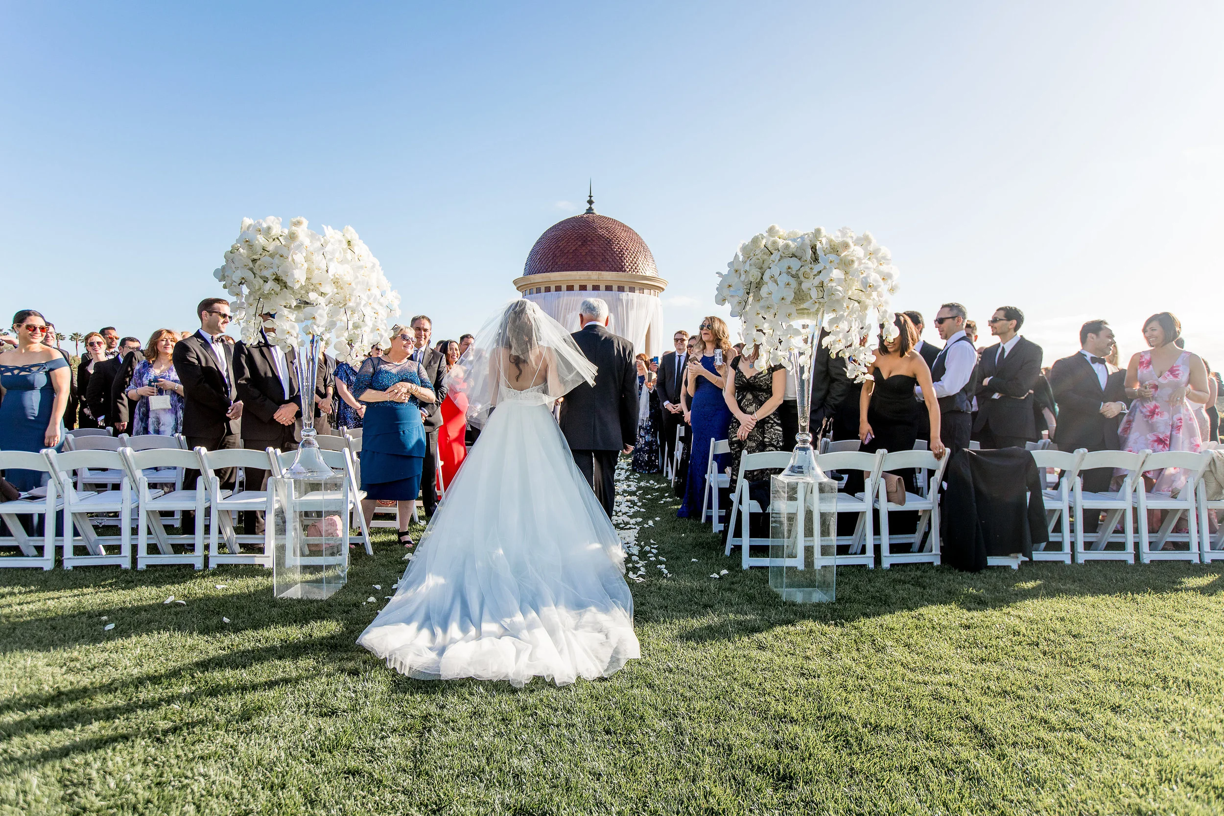 Aboutdetailsdetails | Katie Beverley Photography | Pelican Hill | Ocean View | Rotunda | White draping | White orchid | Glass vases | White roses | Here comes the bride