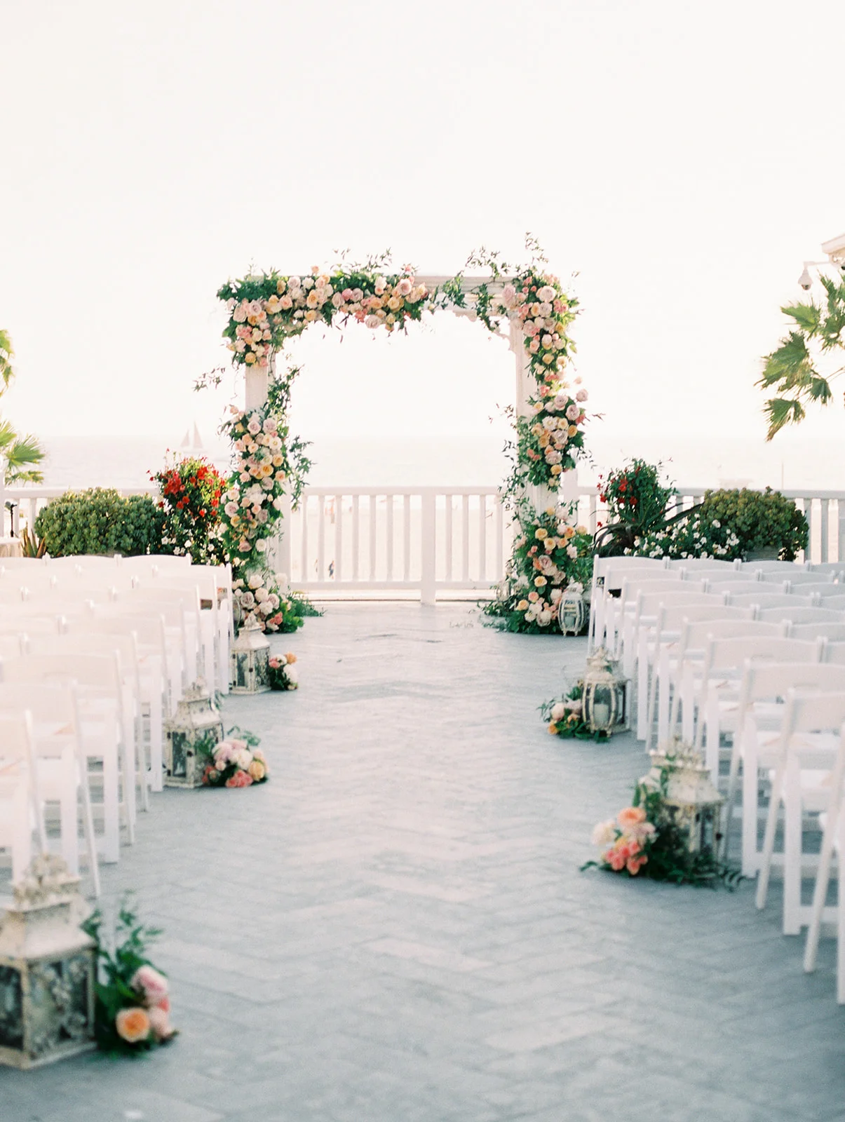 | Aboutdetailsdetails | Outdoor Ceremony | Floral Arch | Lanterns | Beach | Golden Hour | Blush Roses |
