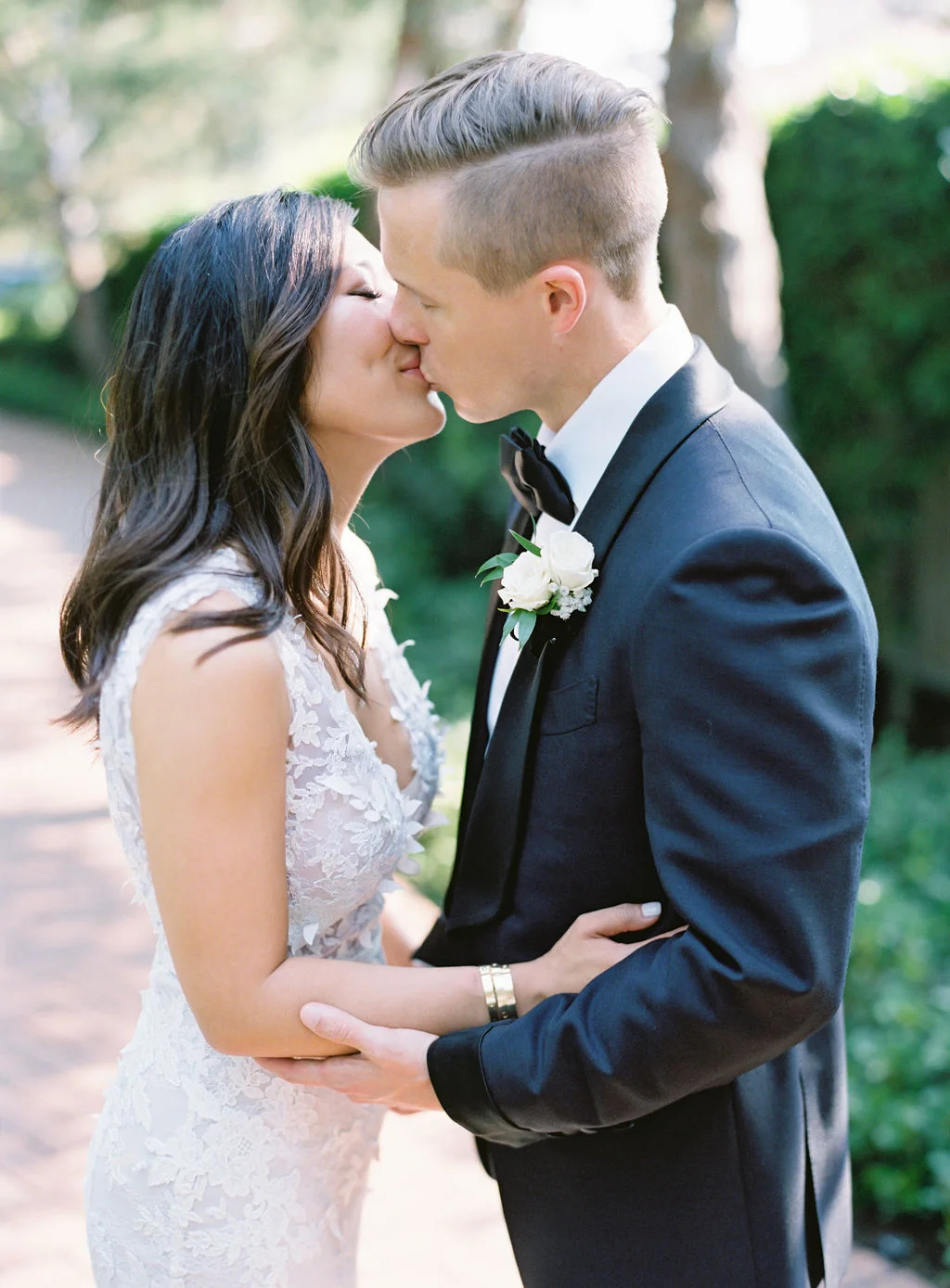 aboutdetailsdetails | bow tie | suit | groom | vows | OCweddingplanner | bride | first look | floral lace wedding dress | kiss | love |