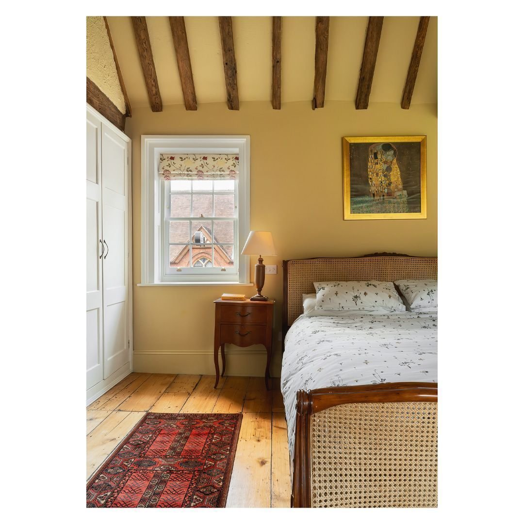 This refurbished bedroom at our project in Berkshire is a story of small changes making a big impact. 'Hay' by @farrowandball has been used on the walls, skirtings and ceiling to emphasise the height and give the space a real warmth. Layers of black 