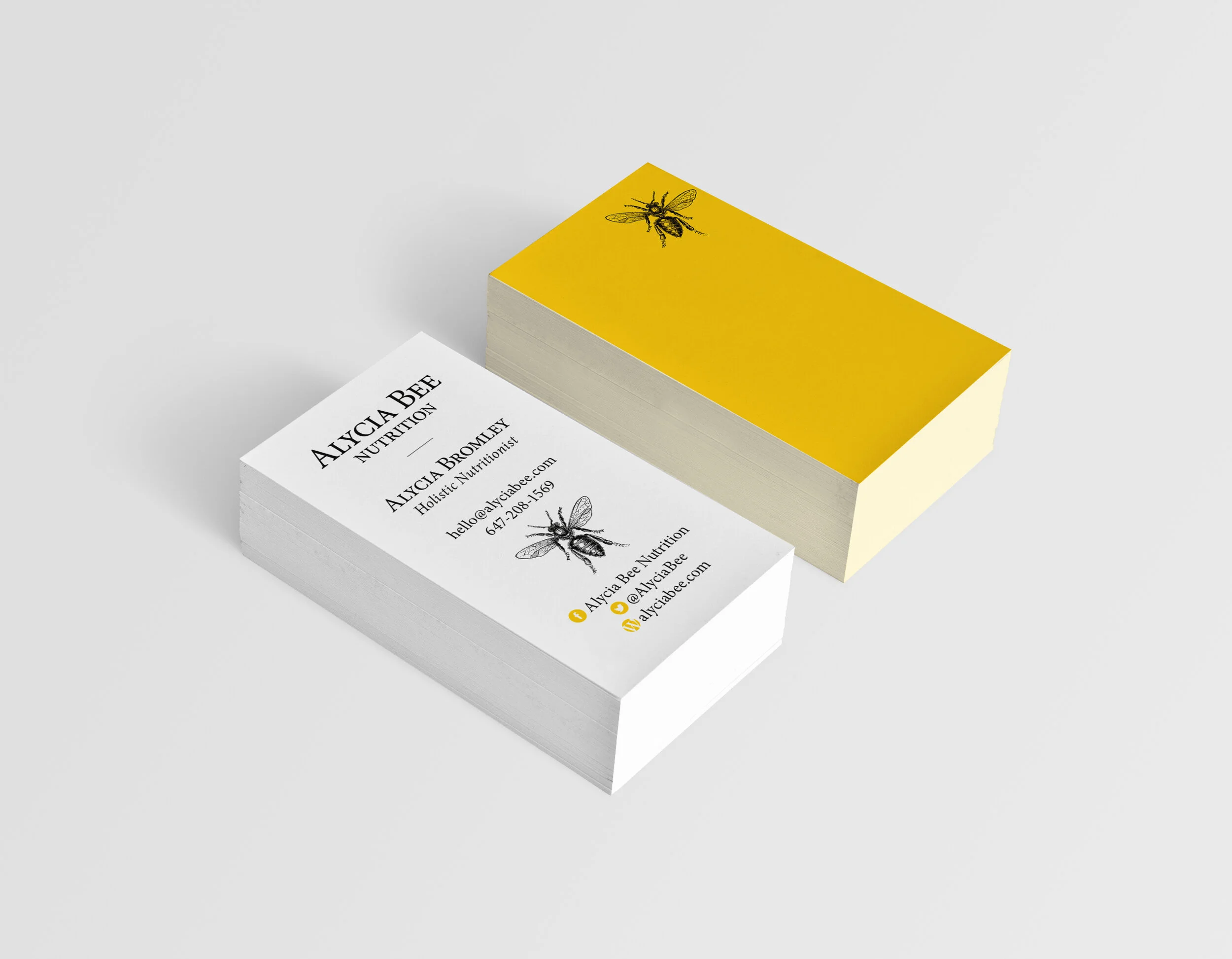  Client: Alycia Bee Nutrition Quantity Produced: 1,000 Production Time: 2 weeks Type Credits: Minion, Minion Bold Print Method: Offset Dimensions: 2 x 3.5″ Stock: Cougar 160lb Cover Colours: Black, PMS 7406 