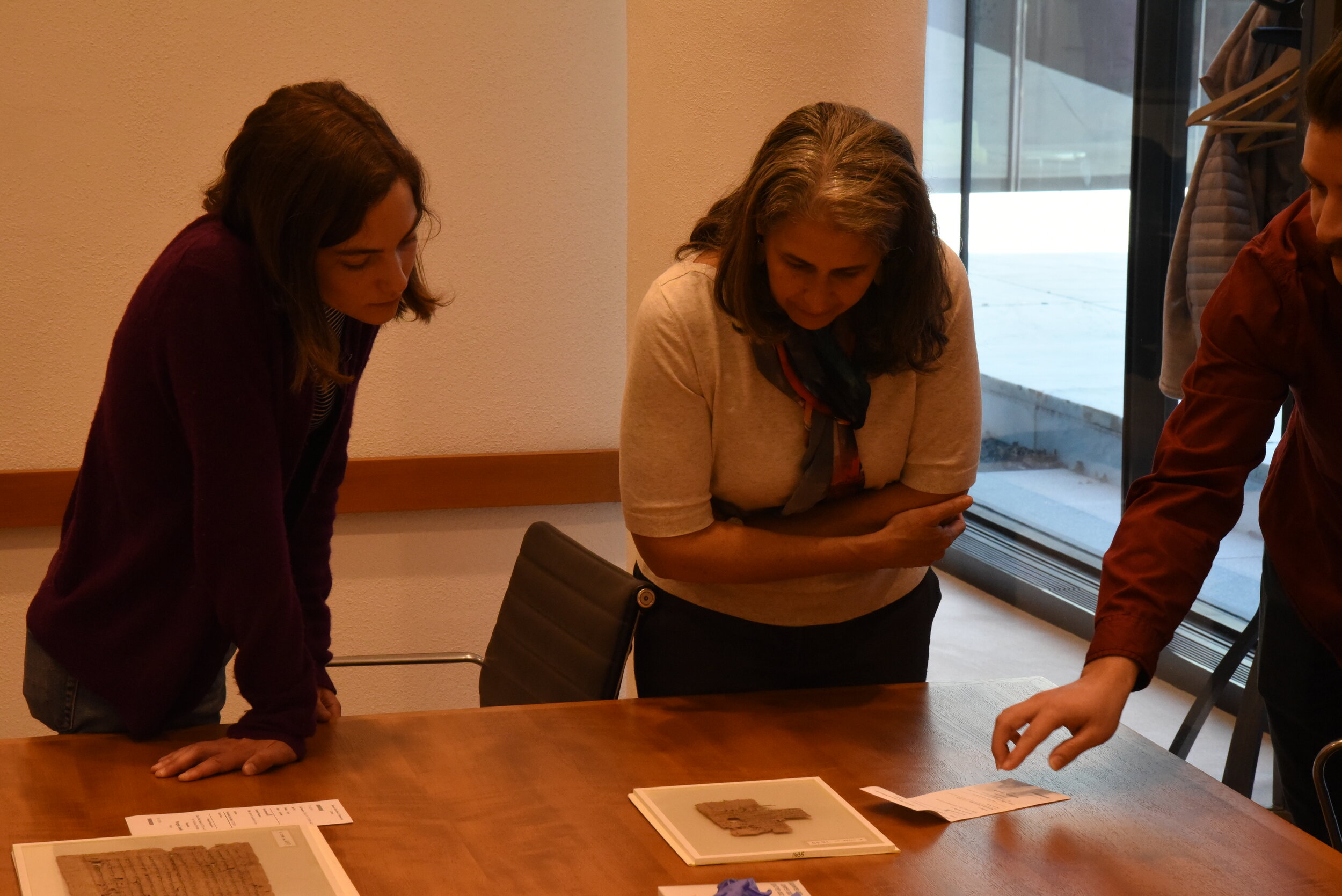  Members of the Yale team examine papyri sources at the Beinecke Rare Book and Manuscript Library, New Haven, CT. 