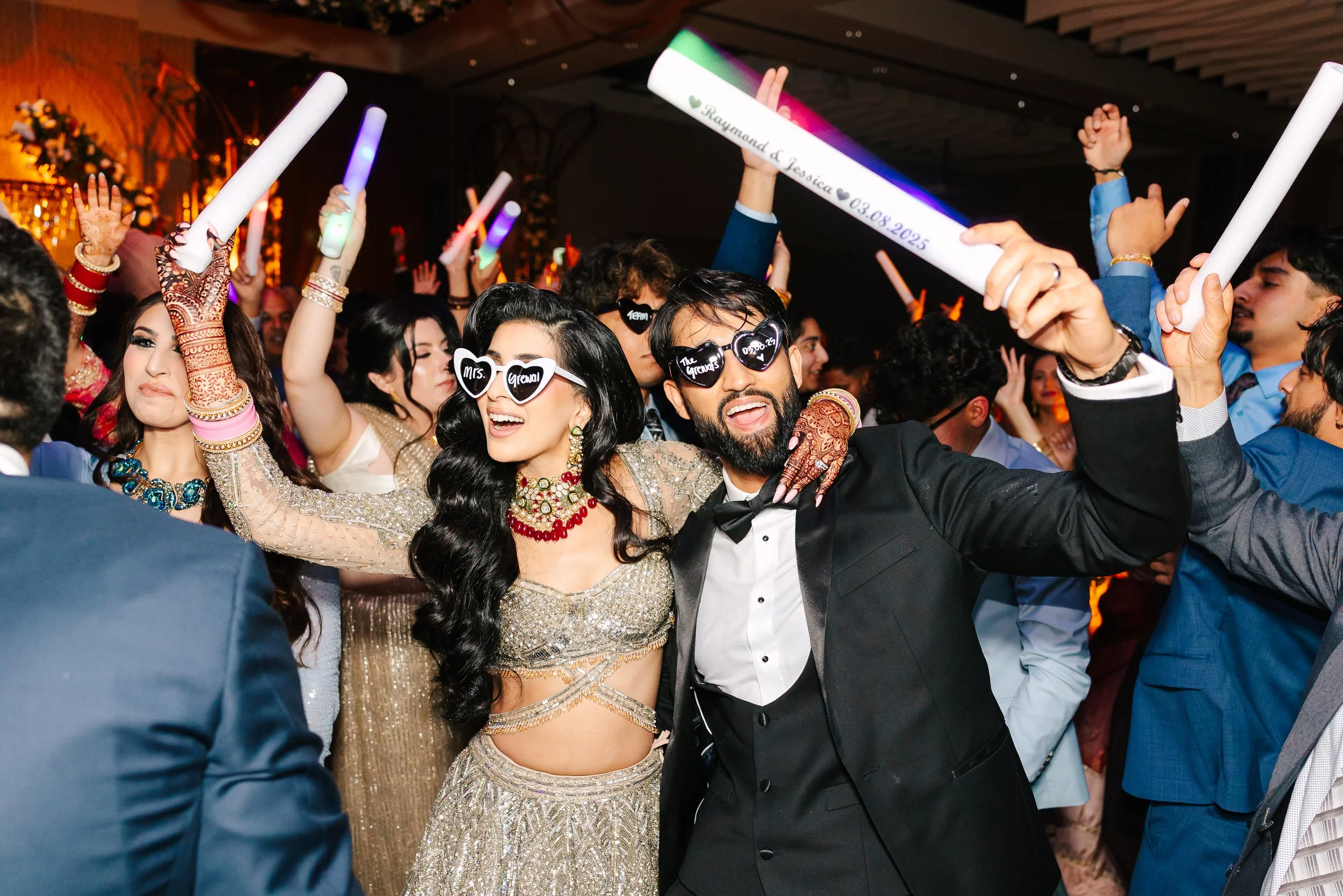 Jessica Gill and Raymond Grewal celebrating their intimate wedding at a private residence in Sherwood Park, Alberta.