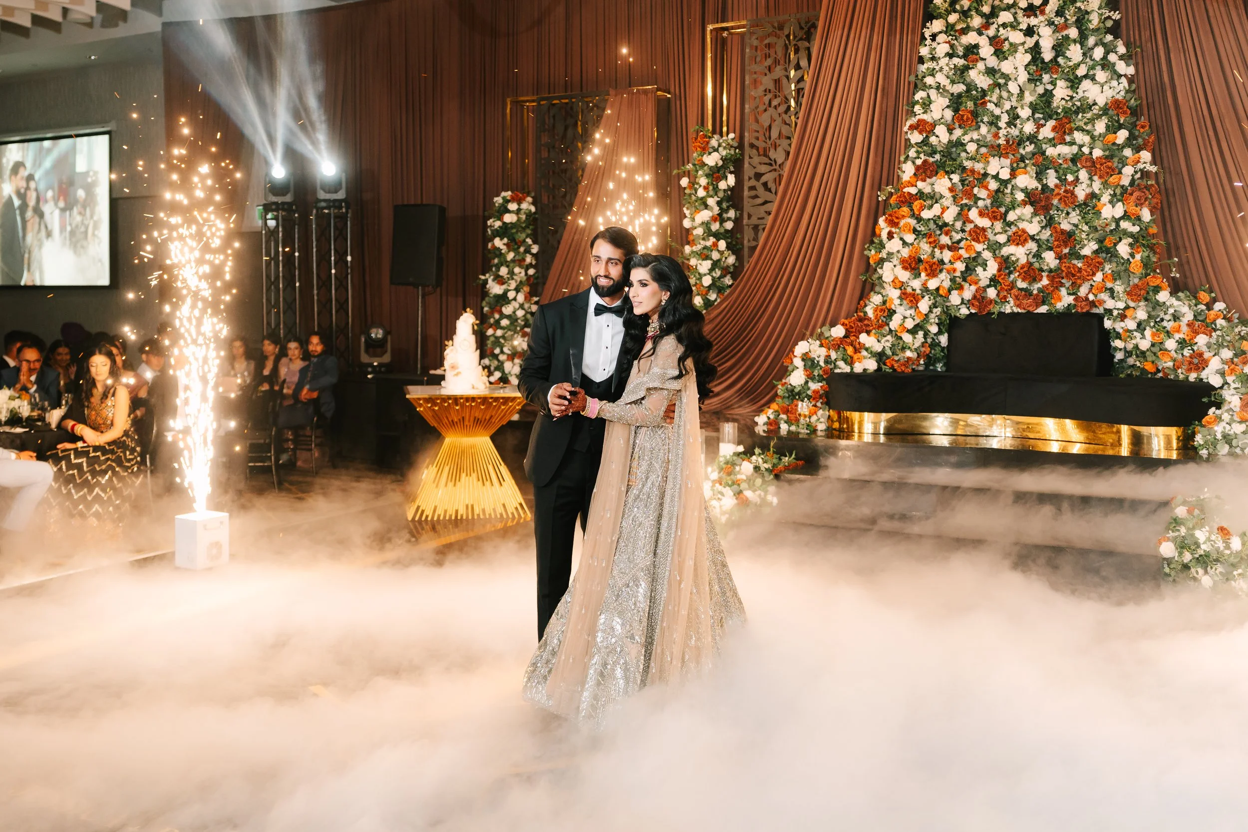 Jessica Gill and Raymond Grewal celebrating their intimate wedding at a private residence in Sherwood Park, Alberta.