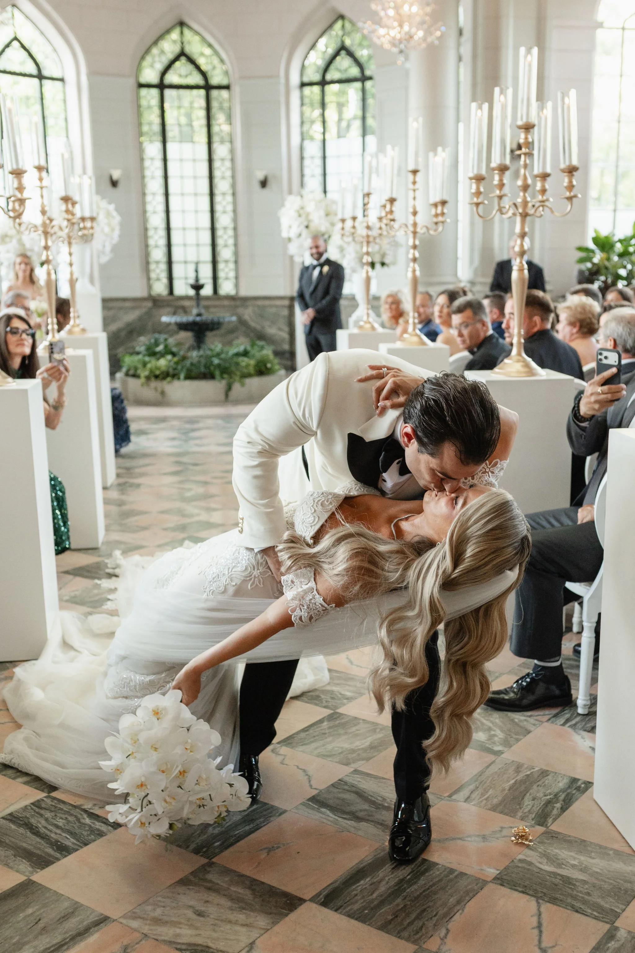 first kiss down the aisle at Casa Loma in Toronto - newlyweds, just married canadian couple
