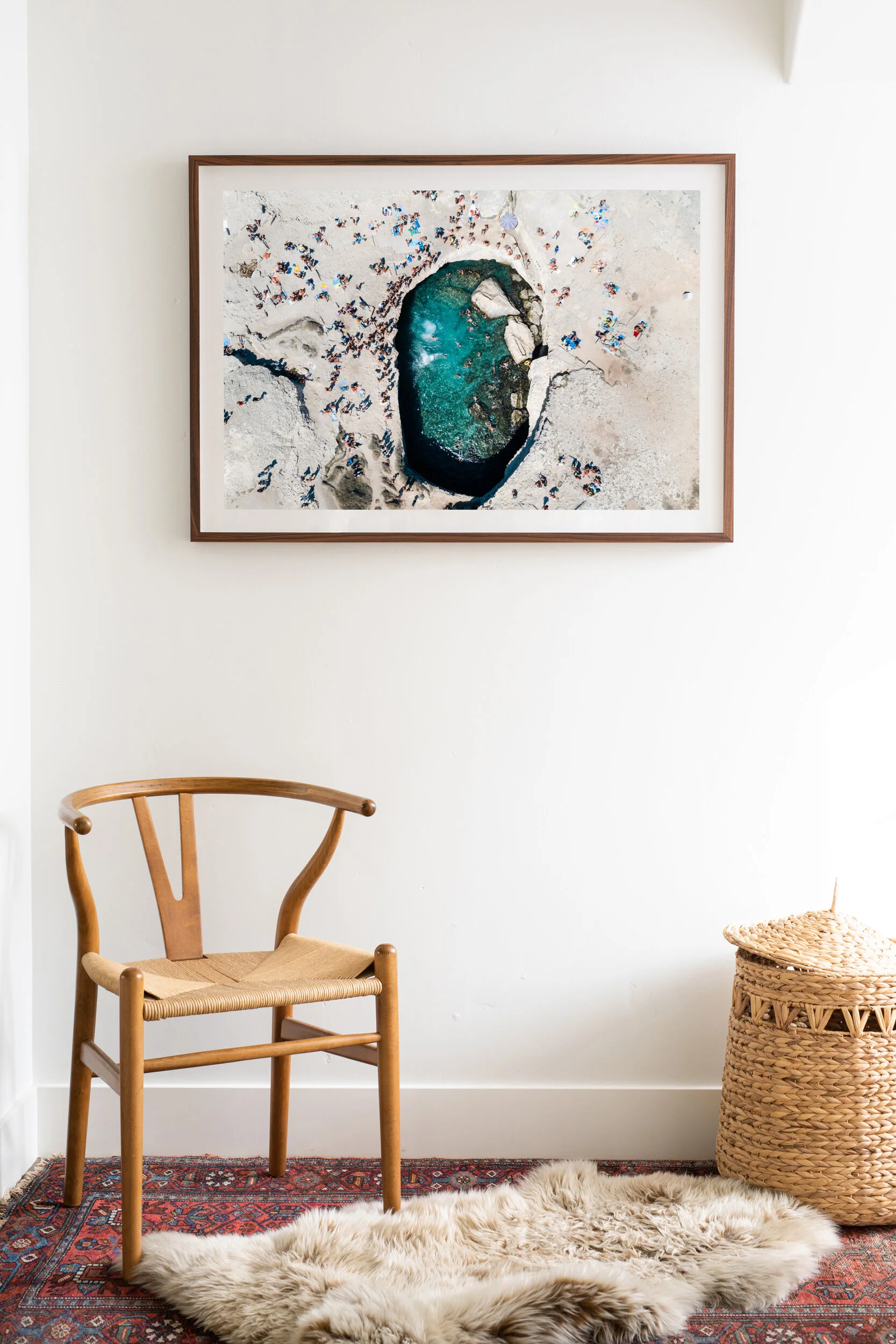 aerial drone image of grotta poesia swimming hole in italy framed with mat hanging on wall