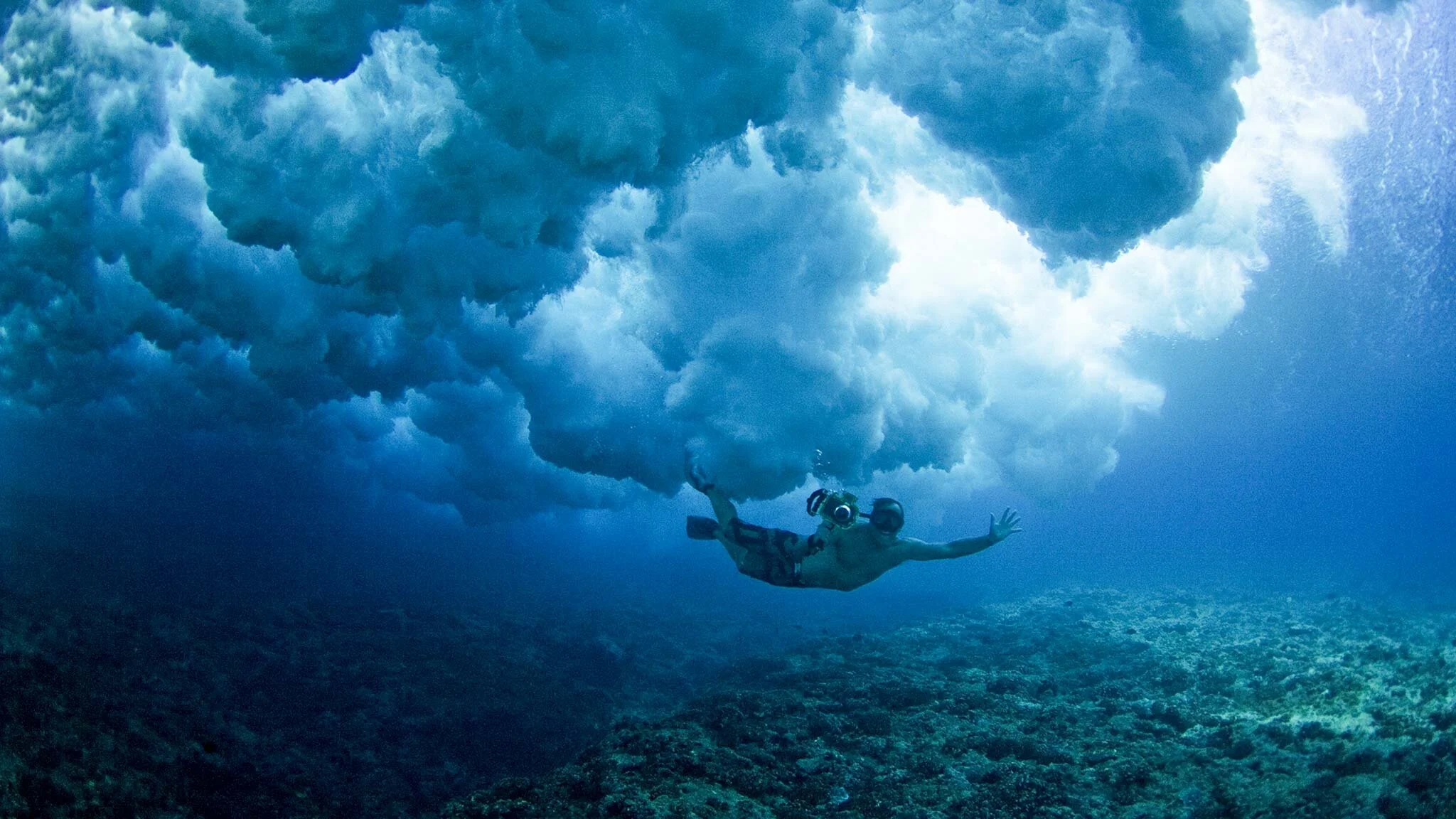 Underwater filming of a breaking wave with a cinema camera water housing