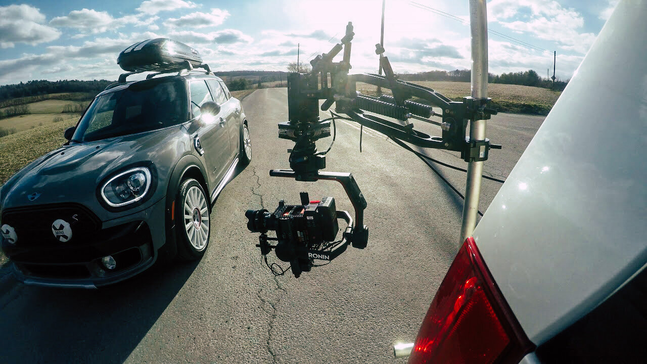Flowcine Black Arm camera tracking vehicle filming a car, available for hire in Cornwall and the South West