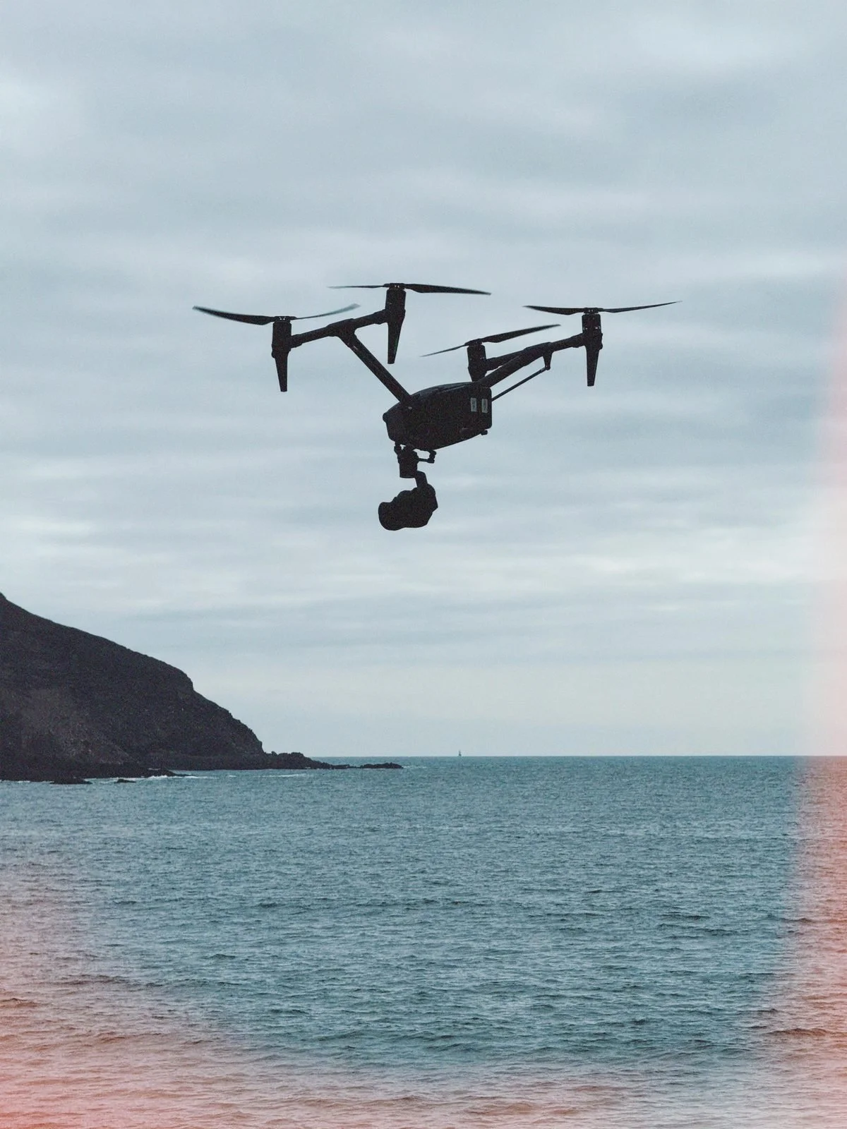 DJI Inspire 3 flying over the sea off the Cornish coast