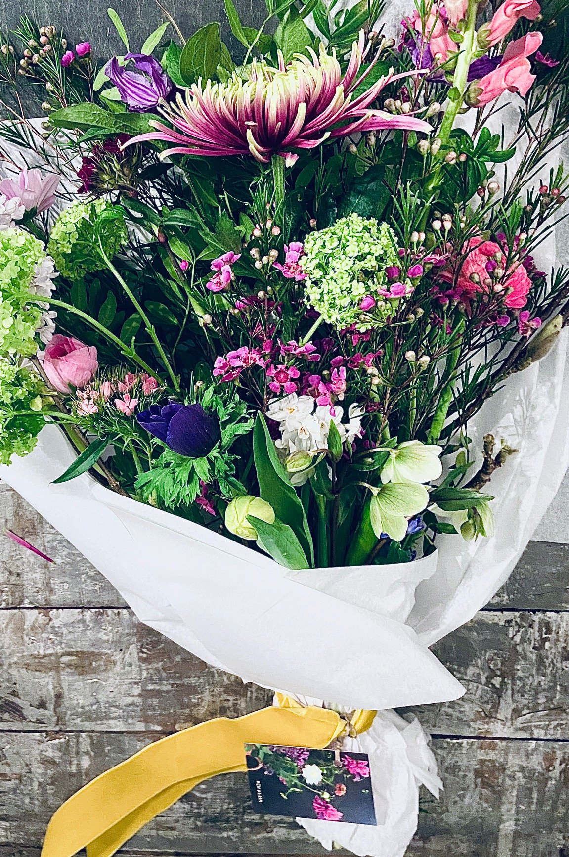 Luxury bouquet: £55 - Featuring chrysanthemum, wax flower, viburnum, anemone, ranunculus, narcissus, hellebore. Please note: some foliage ingredients may vary.