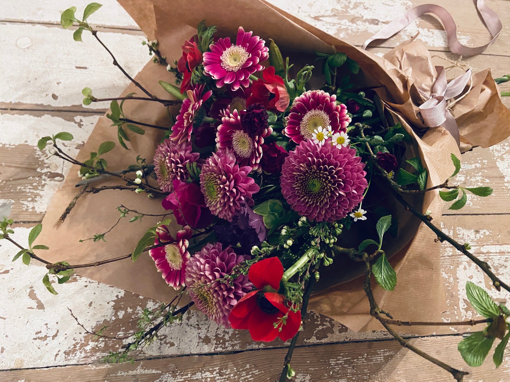 Standard bouquet: £30 - Featuring wax flower, hyacinth, chrysanthemum, anemone, narcissus, antirrhinum. Please note: some foliage ingredients may vary.