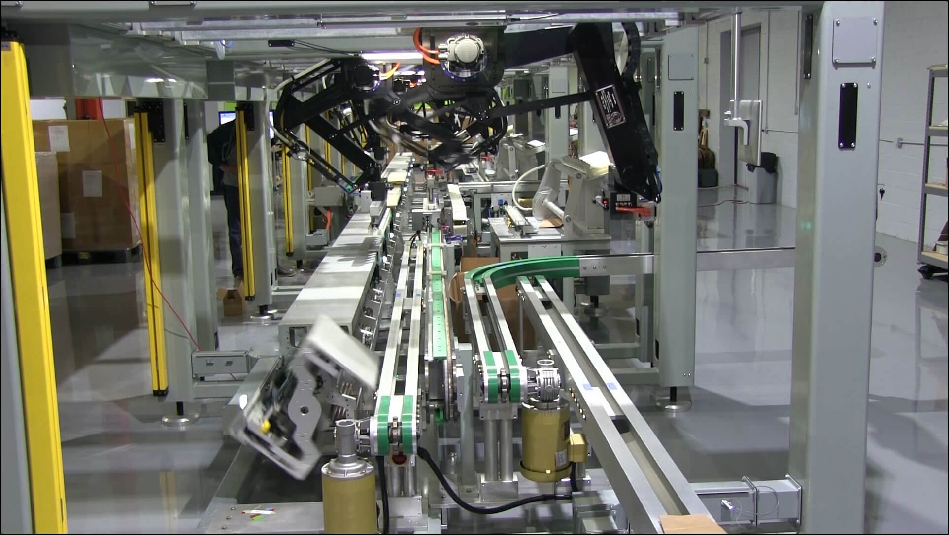 SR-56 2-axis and the robotic hands working in industrial automation packaging system