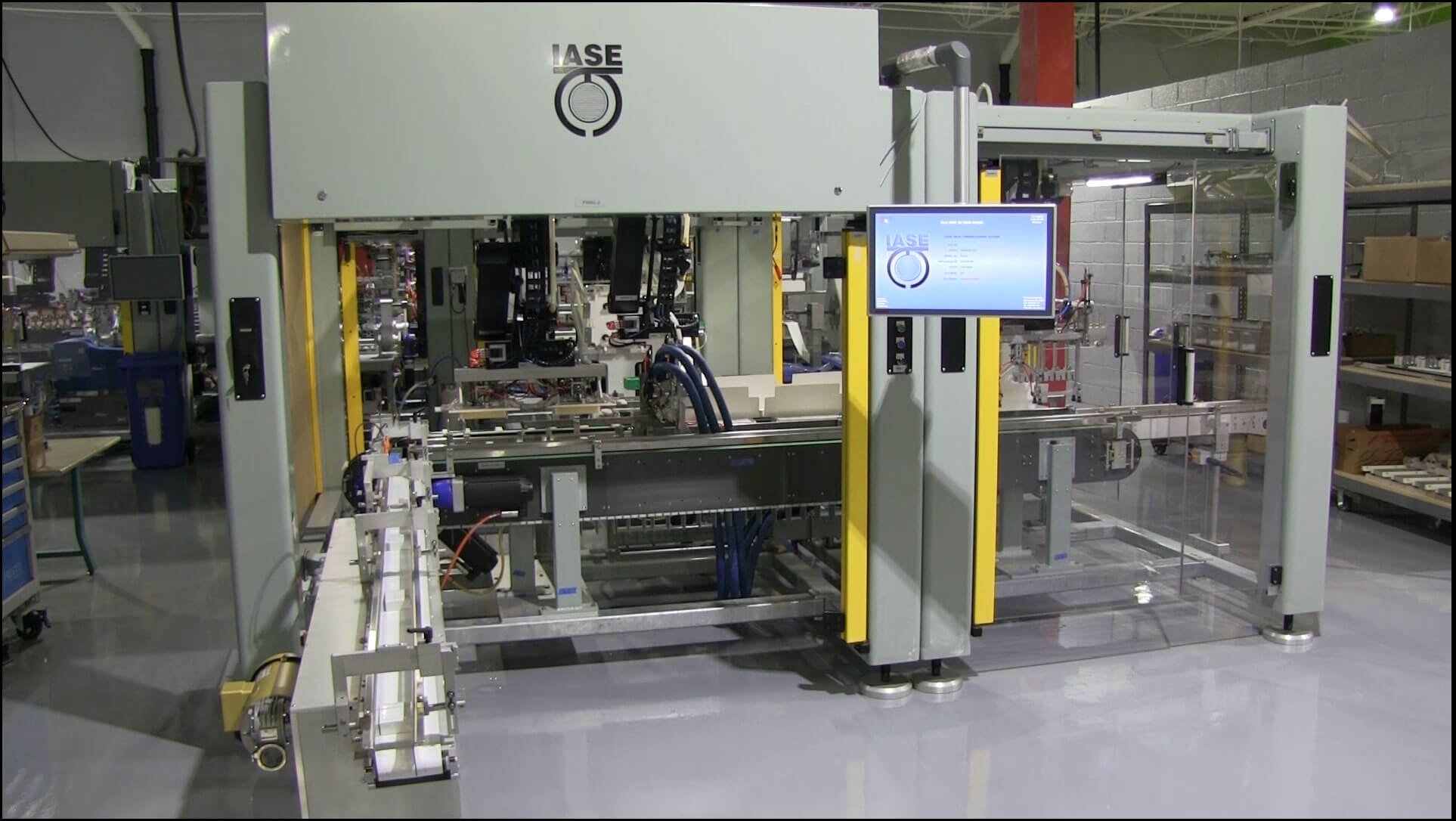 Outside the industrial modular frame automation system ACL-800 with a computer touch screen