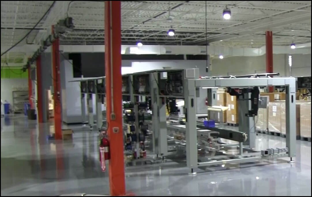 Shop floor at IASE showing the robotic ACL-800 system in New Jersey