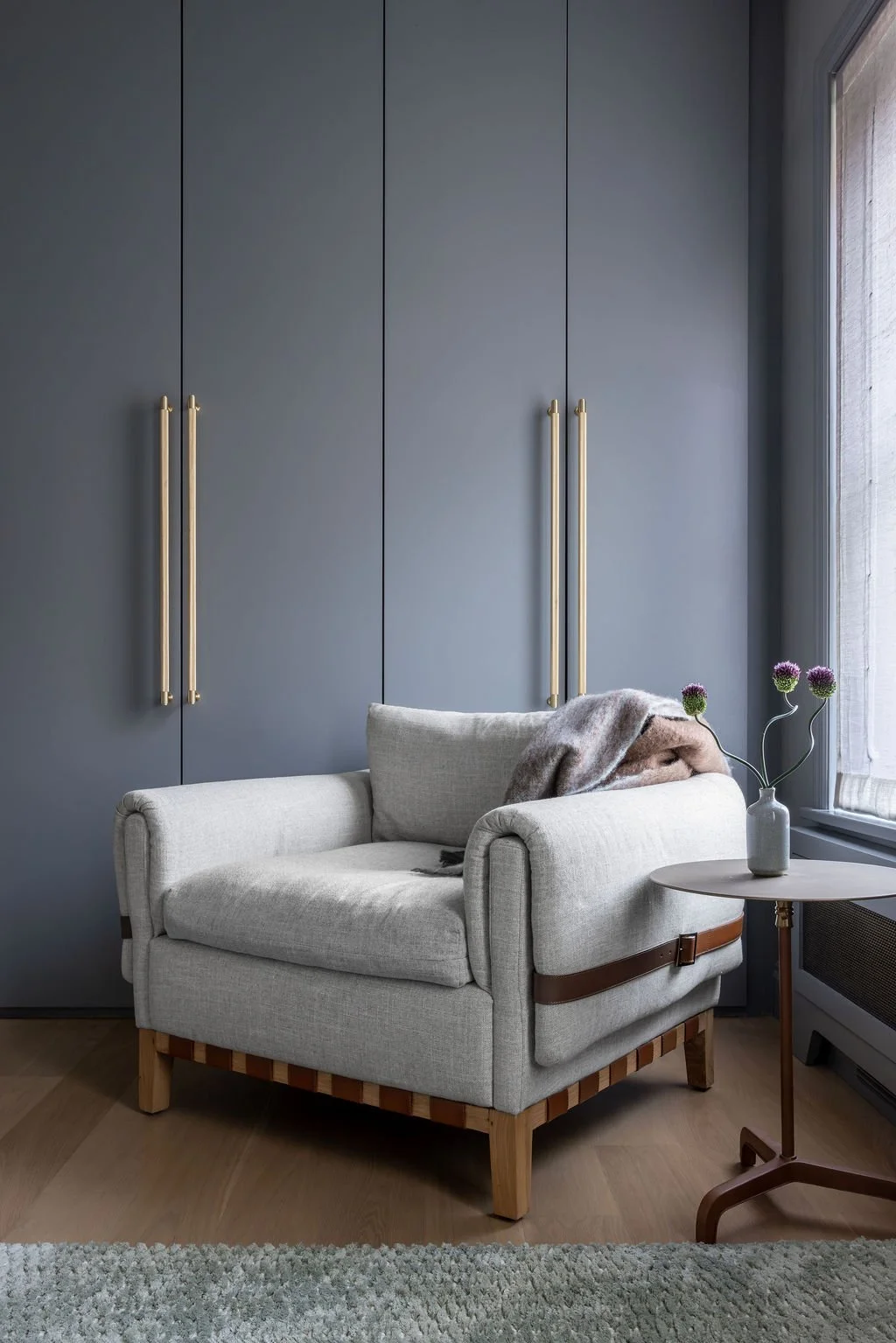 Boucle accent chair in charcoal bedroom corner