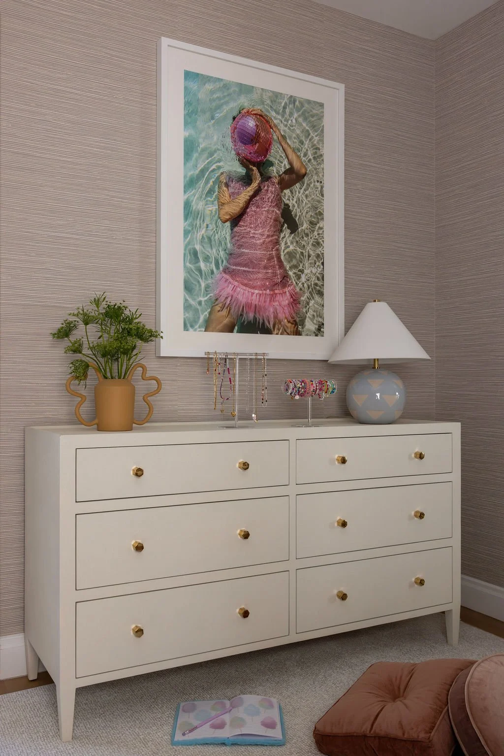 Guest room dresser with figurative art