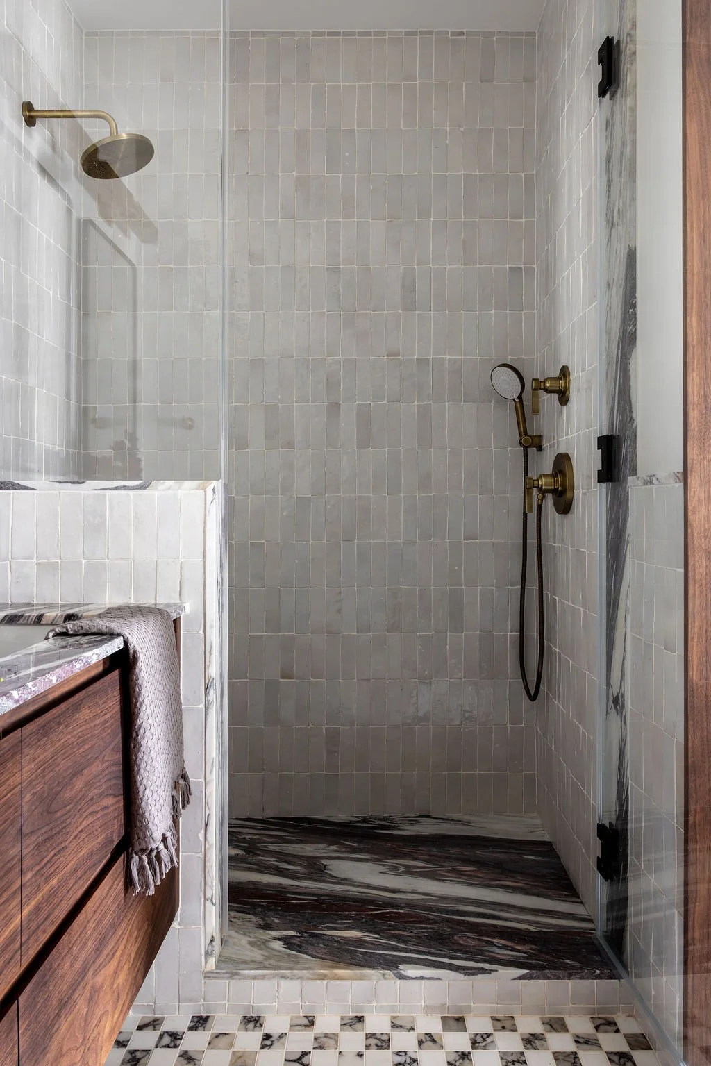 Walk-in shower with marble tile