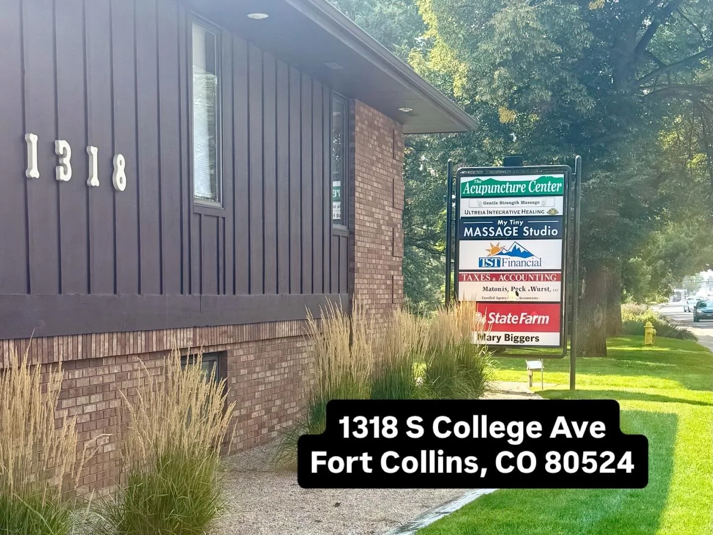 Entrance sign for My Tiny Massage Studio, located on the lower level near the CSU Flower Trial Gardens.