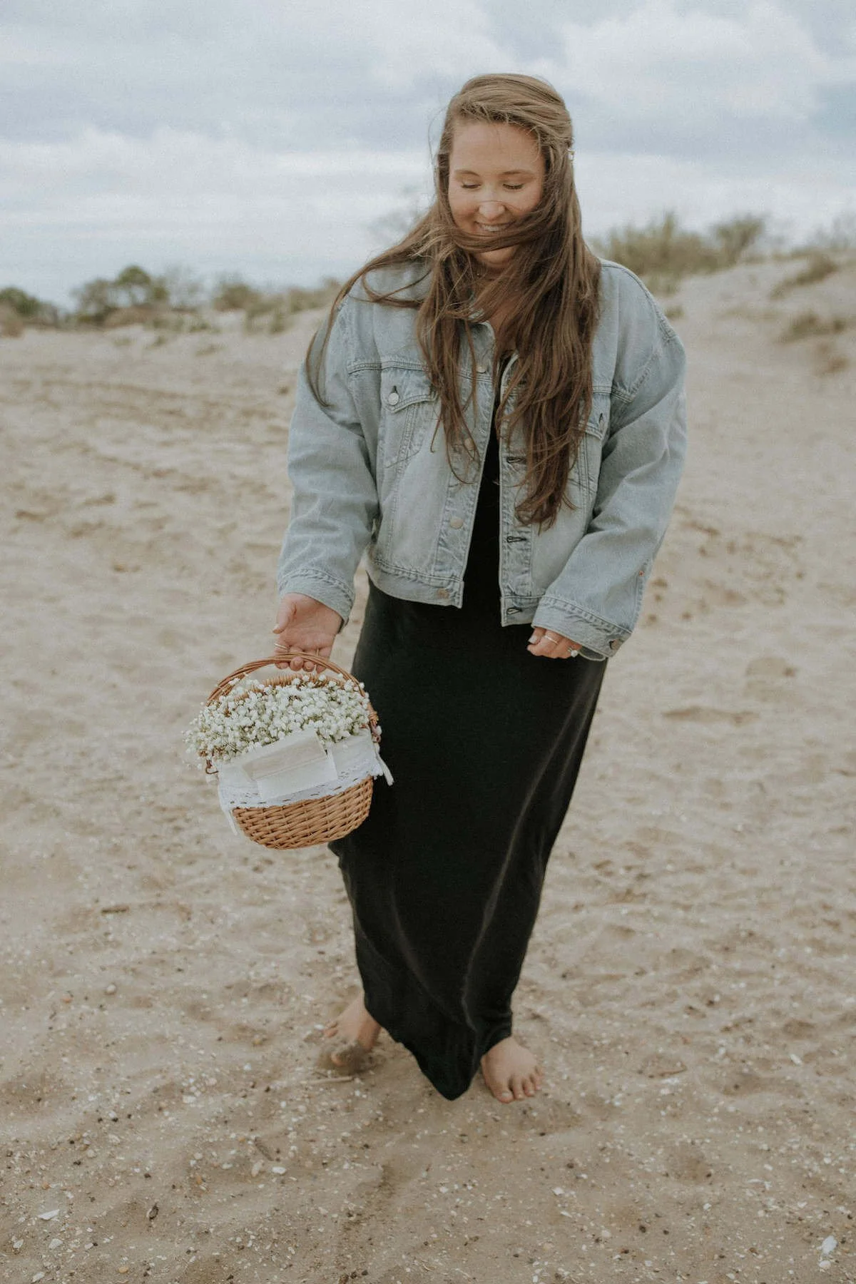 taylor holding basket on beach