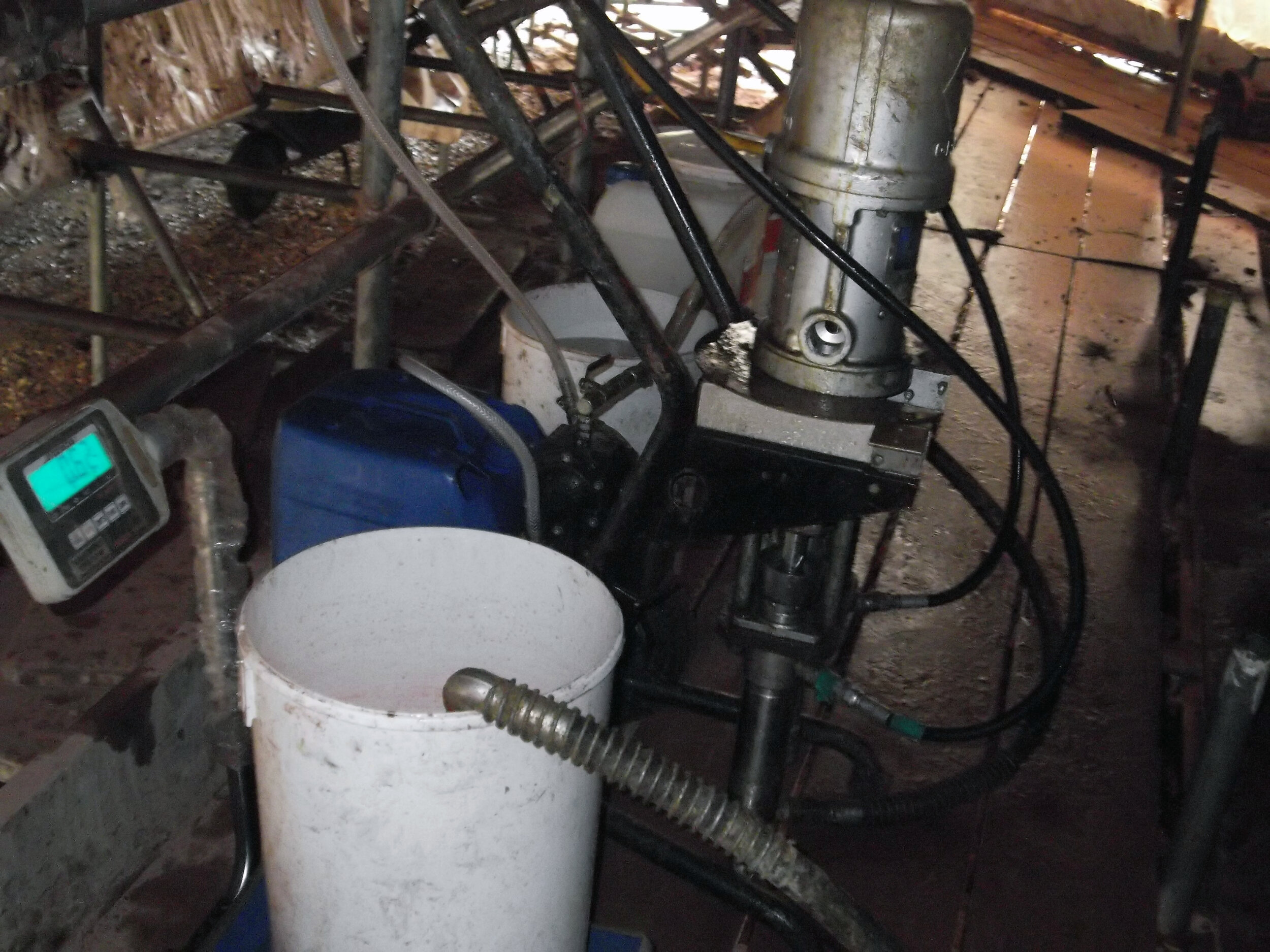 Twin-piston pump set up with scales to measure quantities