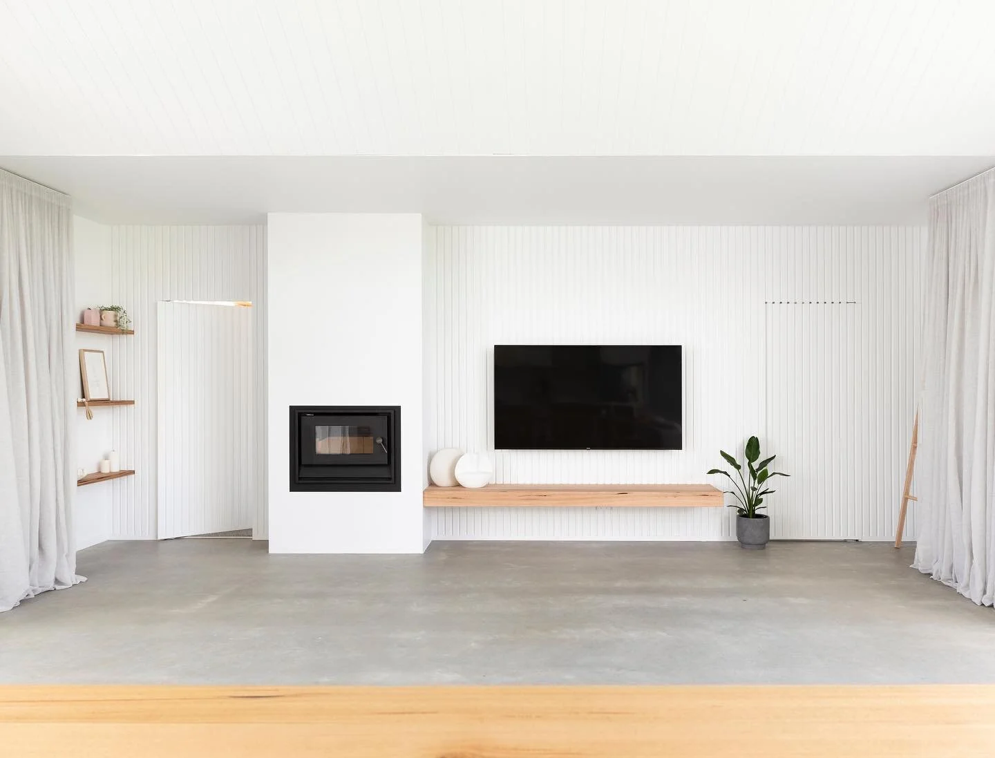 Our timber batten wall with concealed doors perfectly disguises the media and rumpus rooms hiding behind it at our Mill Residence #tystyle