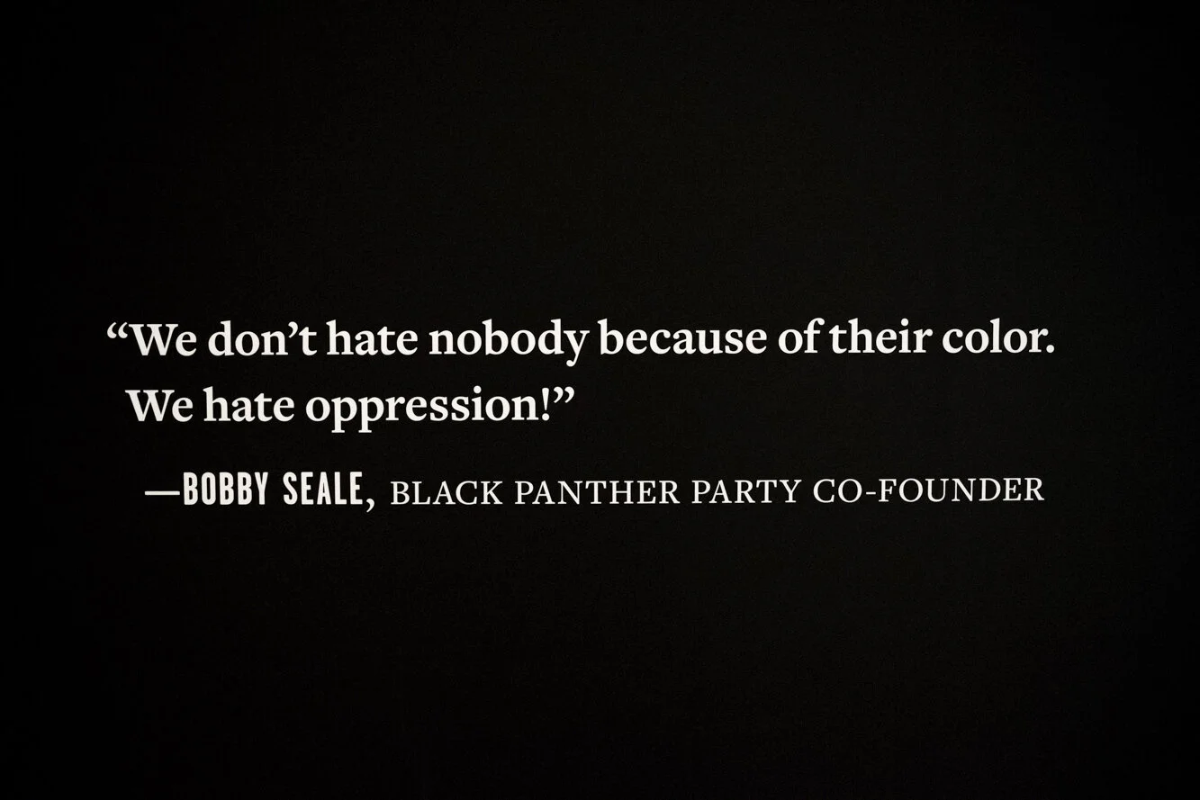 Quote from Bobby Seale, Black Panther Party co-founder: "We don't hate nobody because of their color. We hate oppression!" Photo: Odell Hussey, ©OMCA.