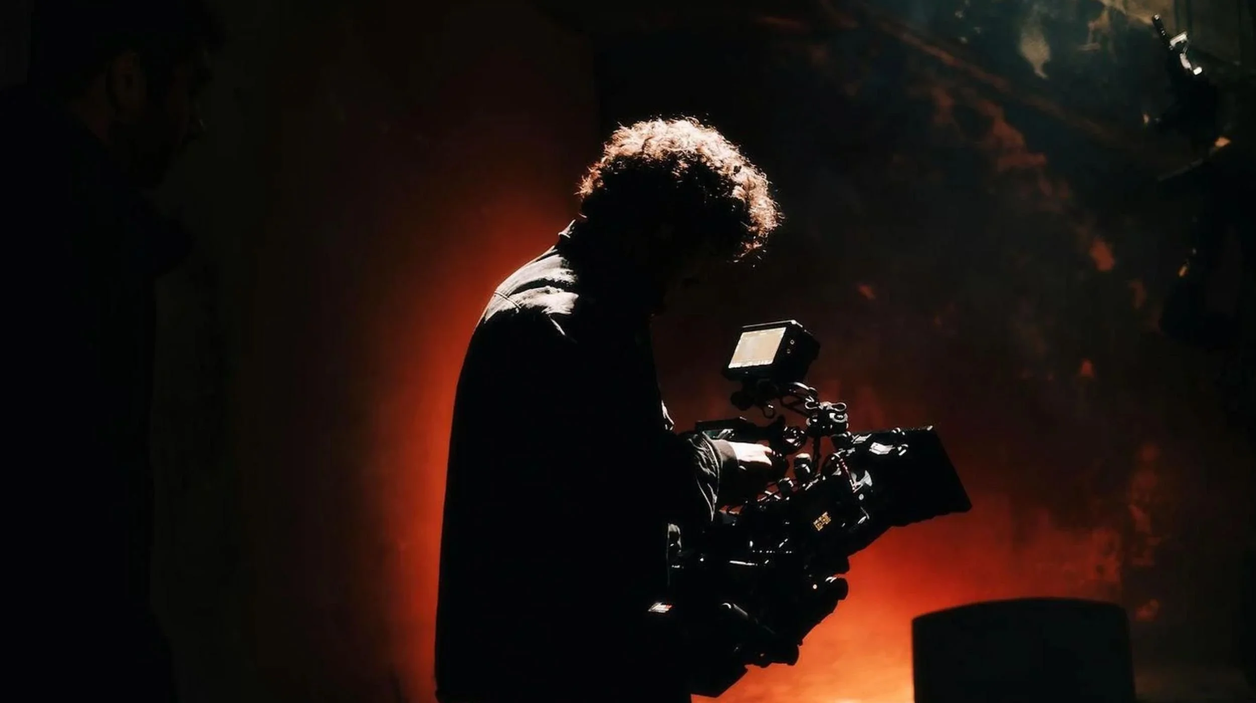 Independent filmmaker working on set, reflecting creative risks and startup innovation.