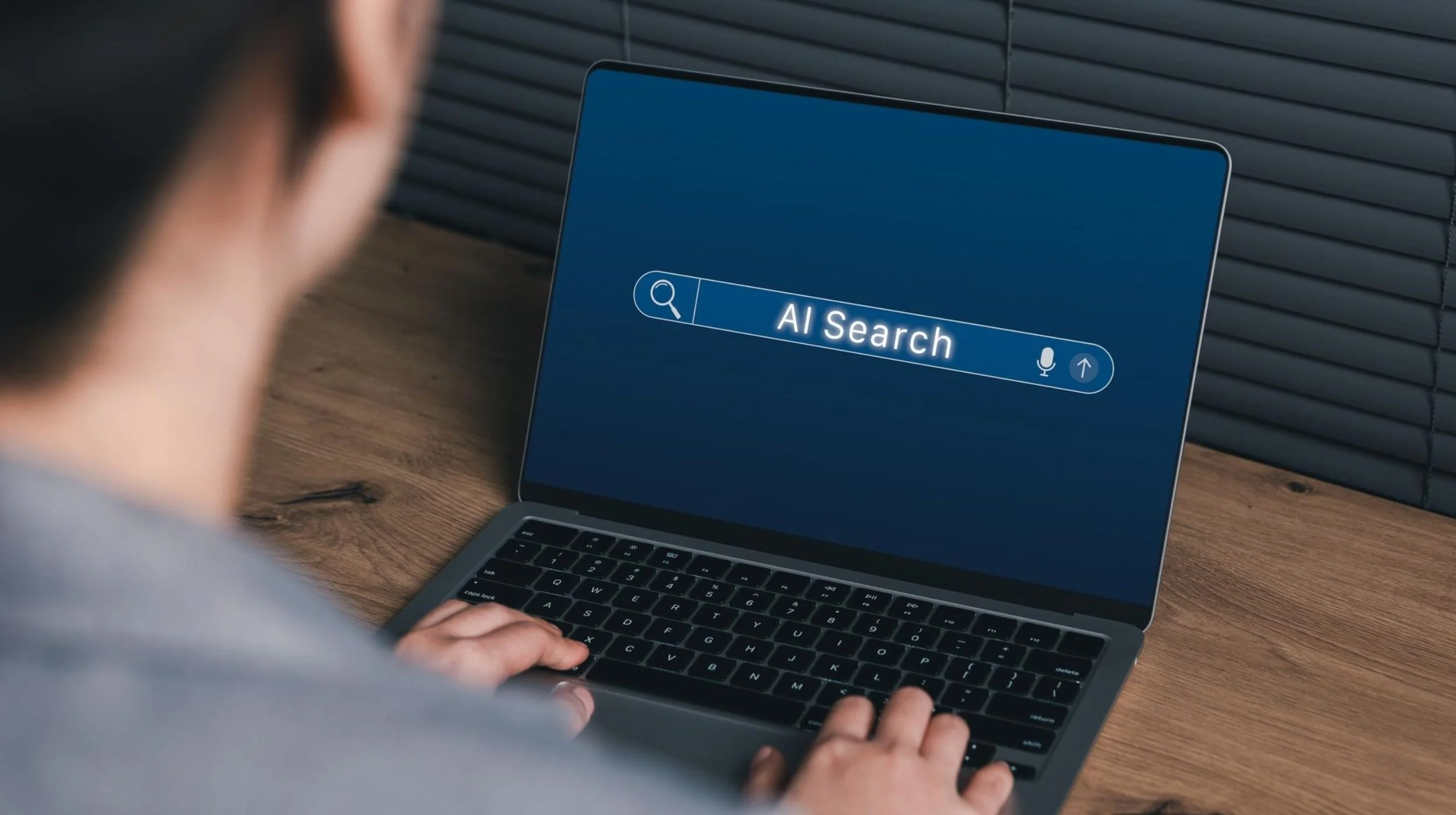 A person researching companies using AI-powered search tools.