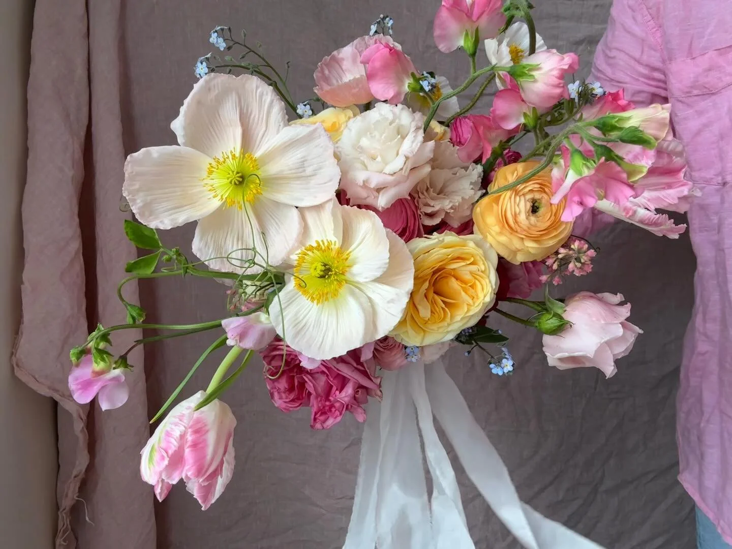 Elitta's pretty bridal bouquet. For me, I loved the buttercream Grandiflora roses, frilly tulips and dancing poppies as the bouquet was carried.