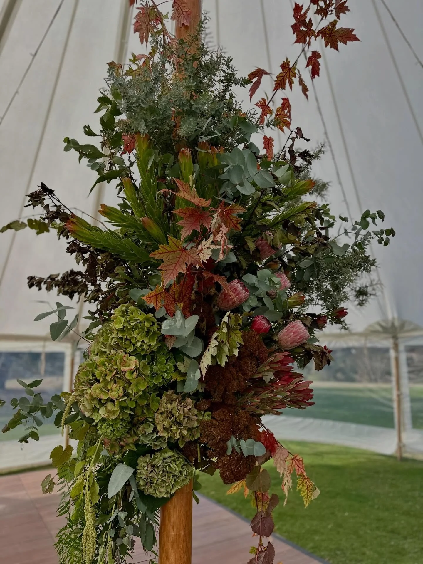 Textural, autumnal installations for Robyn &amp; Declan composed of maple, hydrangea, sedum, kale, proteas and amaranthus stems, with beautiful gum branches from our plantations. These seasonal, nature inspired designs drew guest's attention to the m