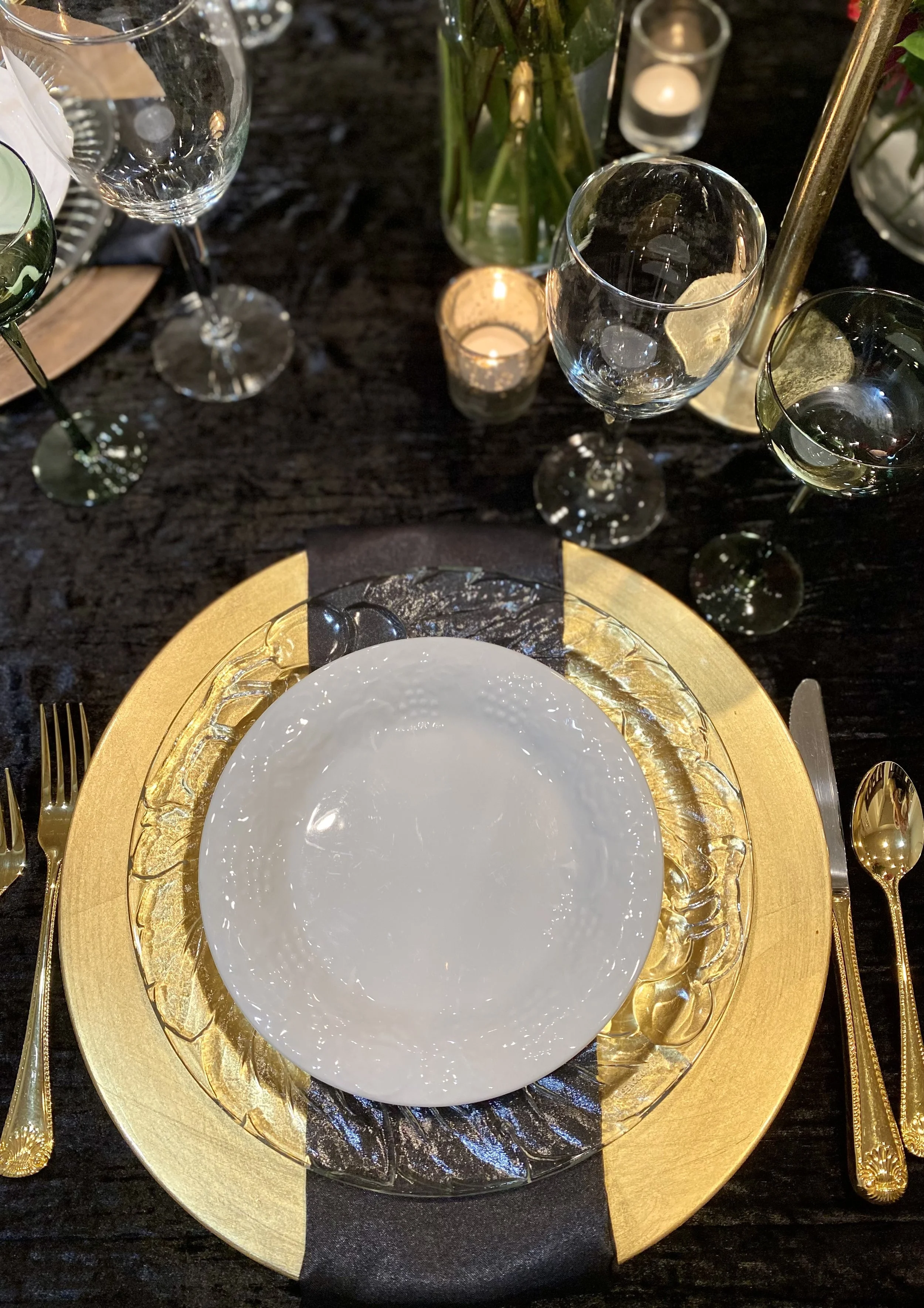 Gold and glass place settings