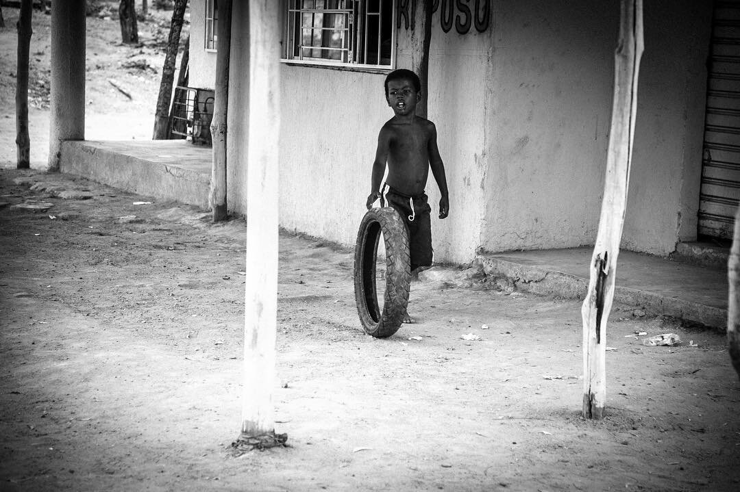 Boy with tyre 
#caribe #palenque #colombia #instagram #onlocation #latinoamerica #southamerica #travel
#apfmagazine #hikaricreative #travelphotography #wearethestreet #streetphotography #life_is_street #urbanstreet #capturestreets #blackandwhite