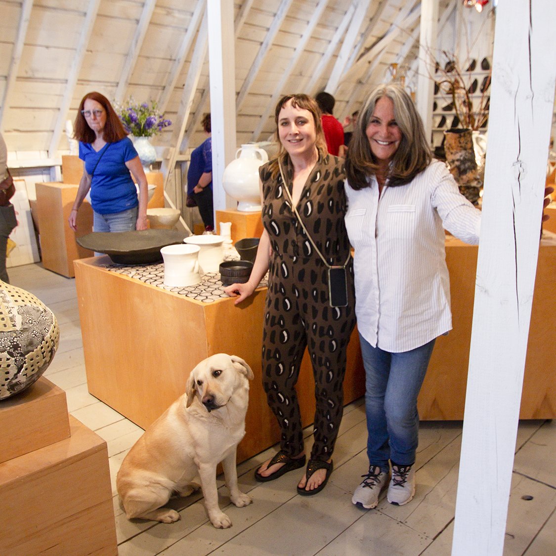 Original host potter Connee Mayeron (right) with her host protege Ani Kasten in their Barn Gallery, 2022. Photo credit: Amber White.