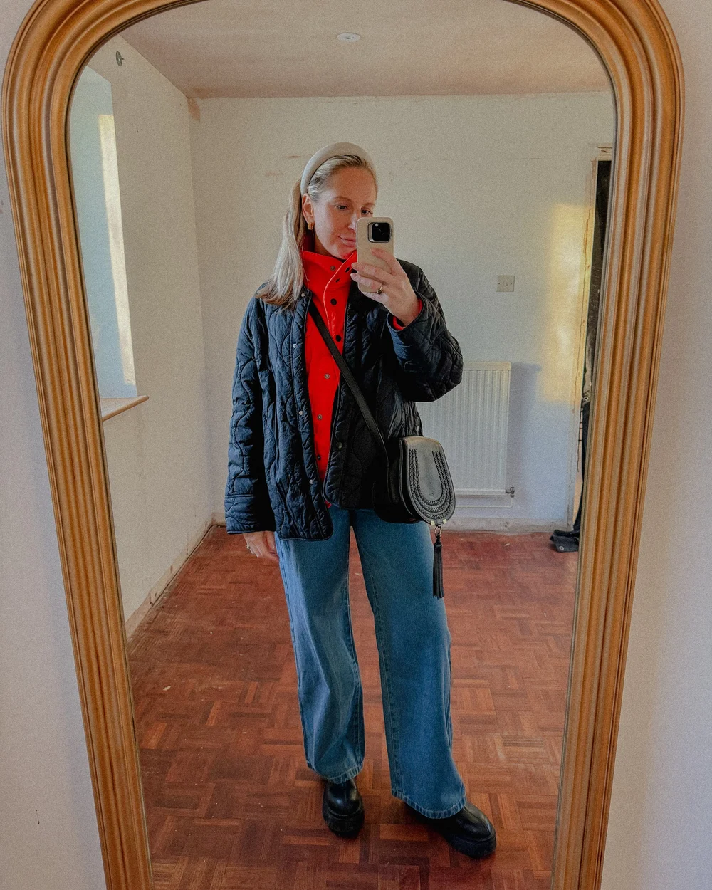 Girl wearing a quilted black coat