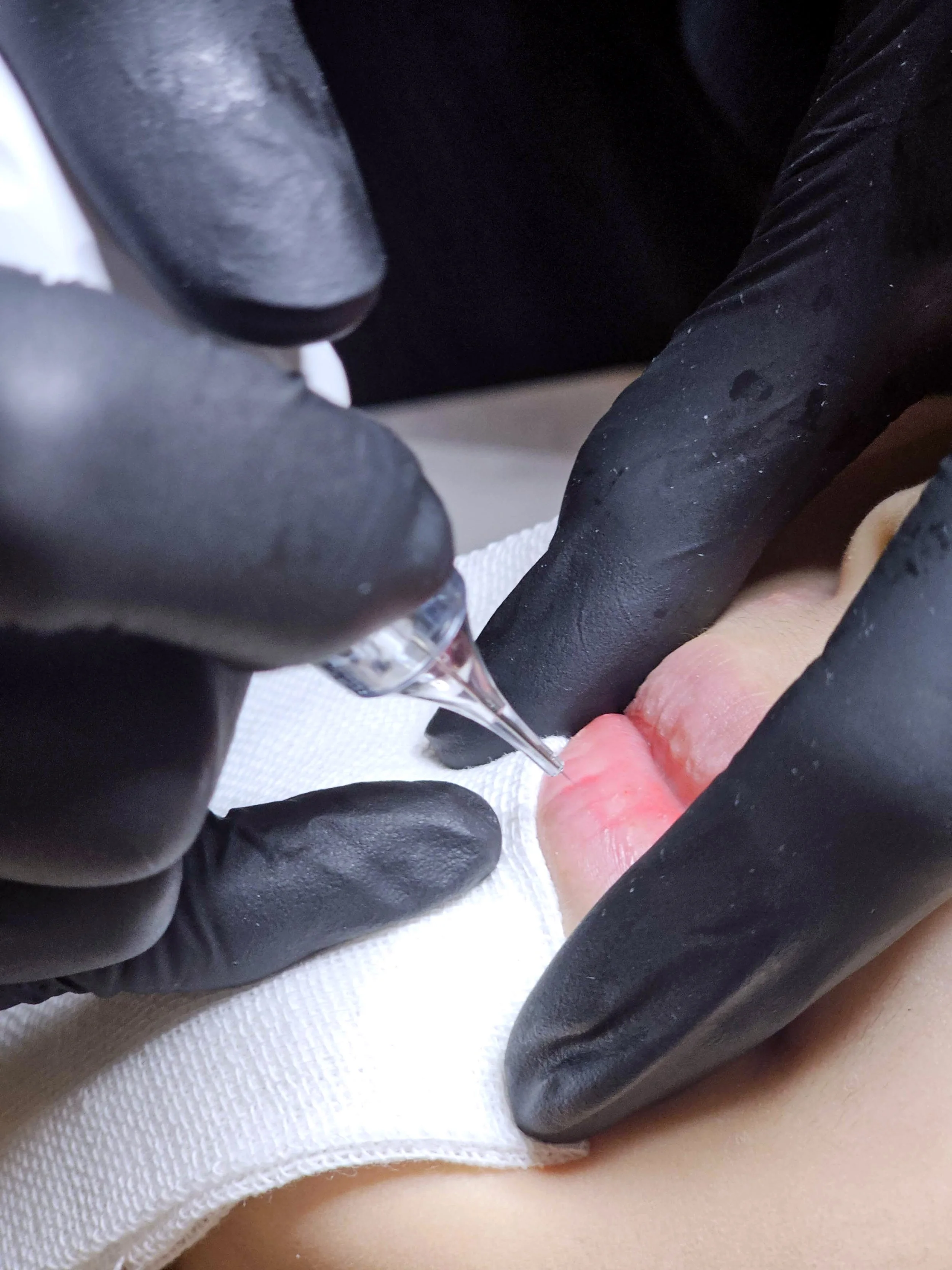 Close-up of lips during exfoliating and plumping treatment—smooth, healthy lips begin at The Brow & Beauty Boutique.