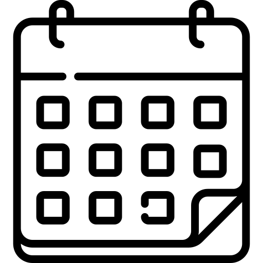 Silhouette of a lion standing on a tree branch.
