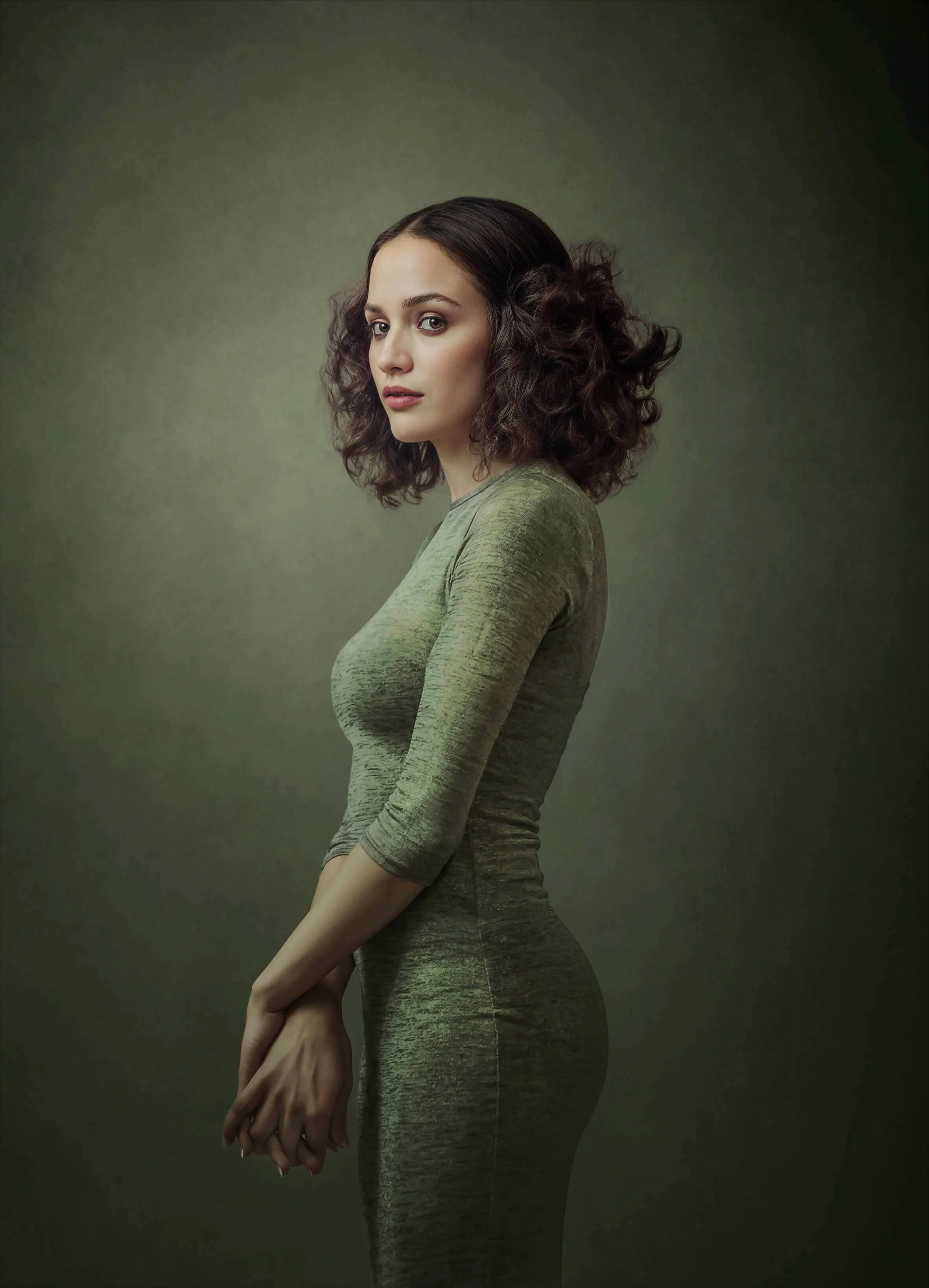 studio-portrait-of-a-woman-in-green