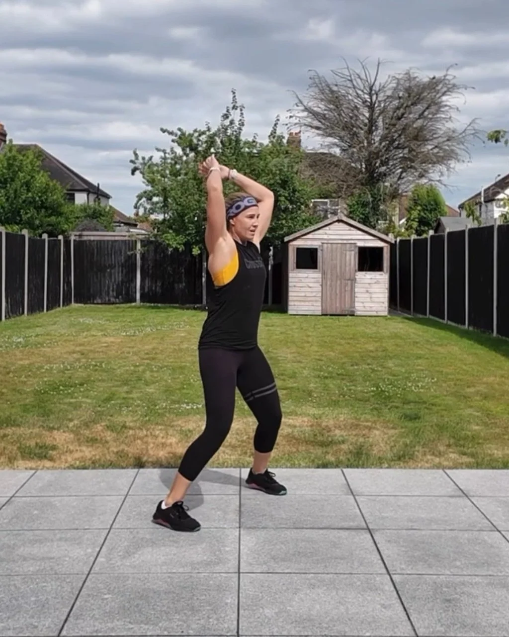 girl doing jumping jacks