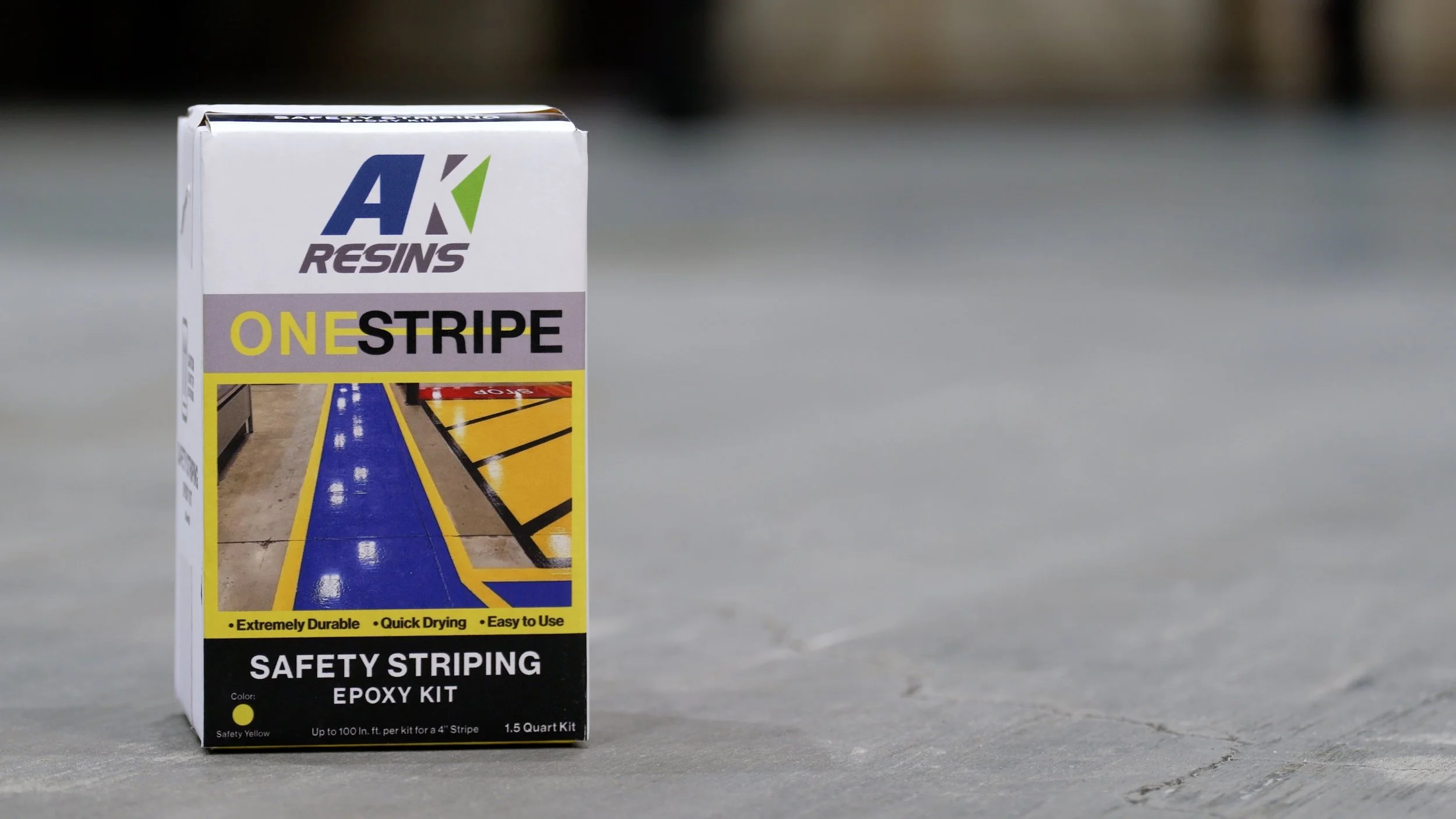 OneStripe Safety Striping Epoxy Kit package in a warehouse