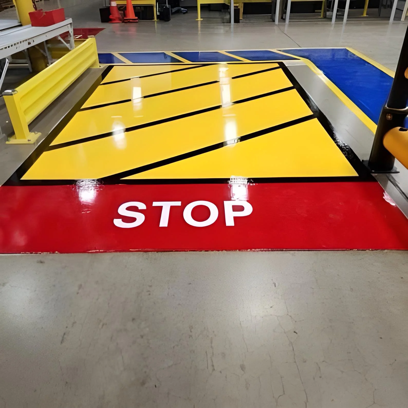AK Resins Uni-Cote epoxy top coat installed in a warehouse for stop signs and walkways
