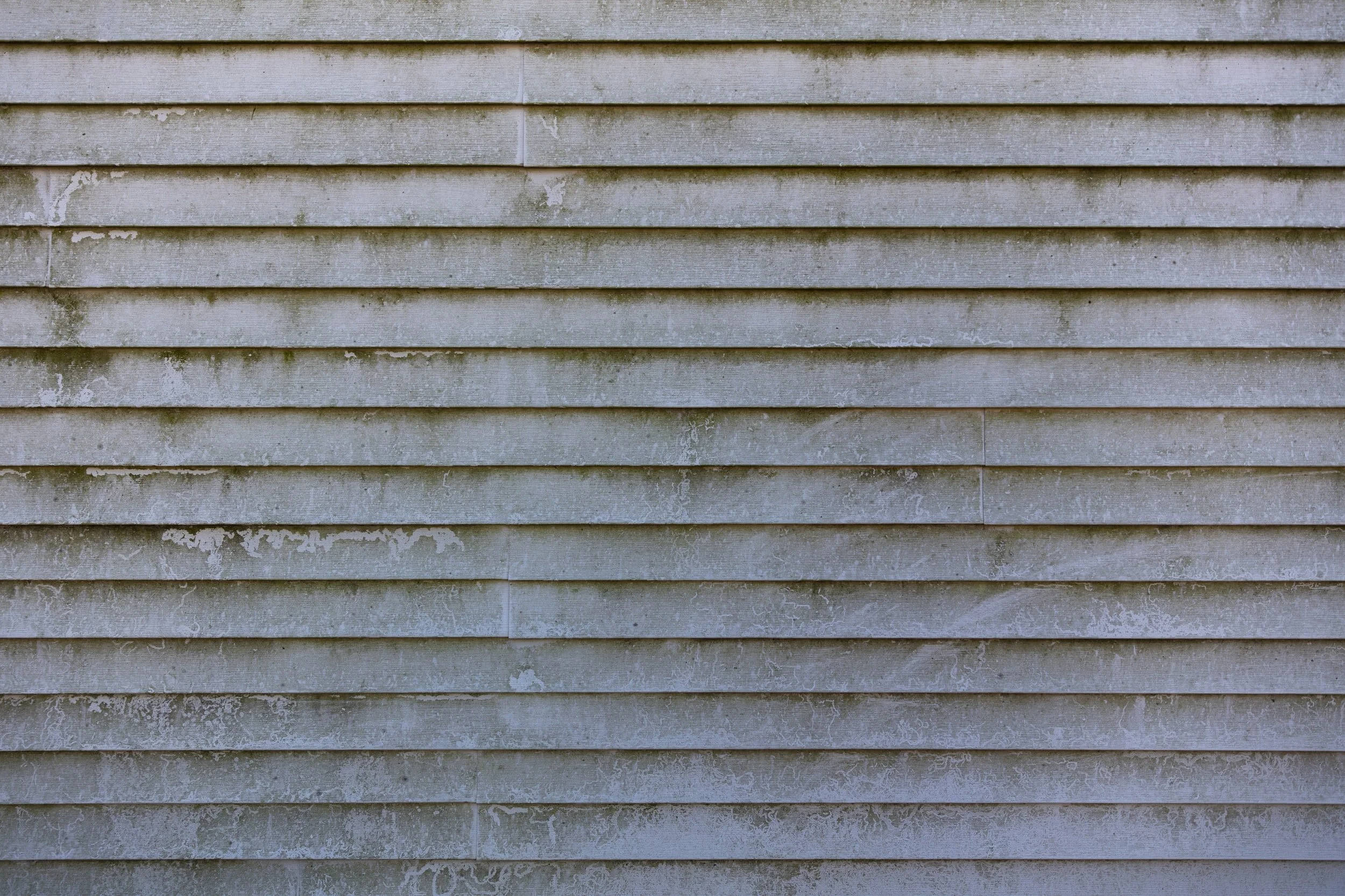 How do I clean my vinyl siding?