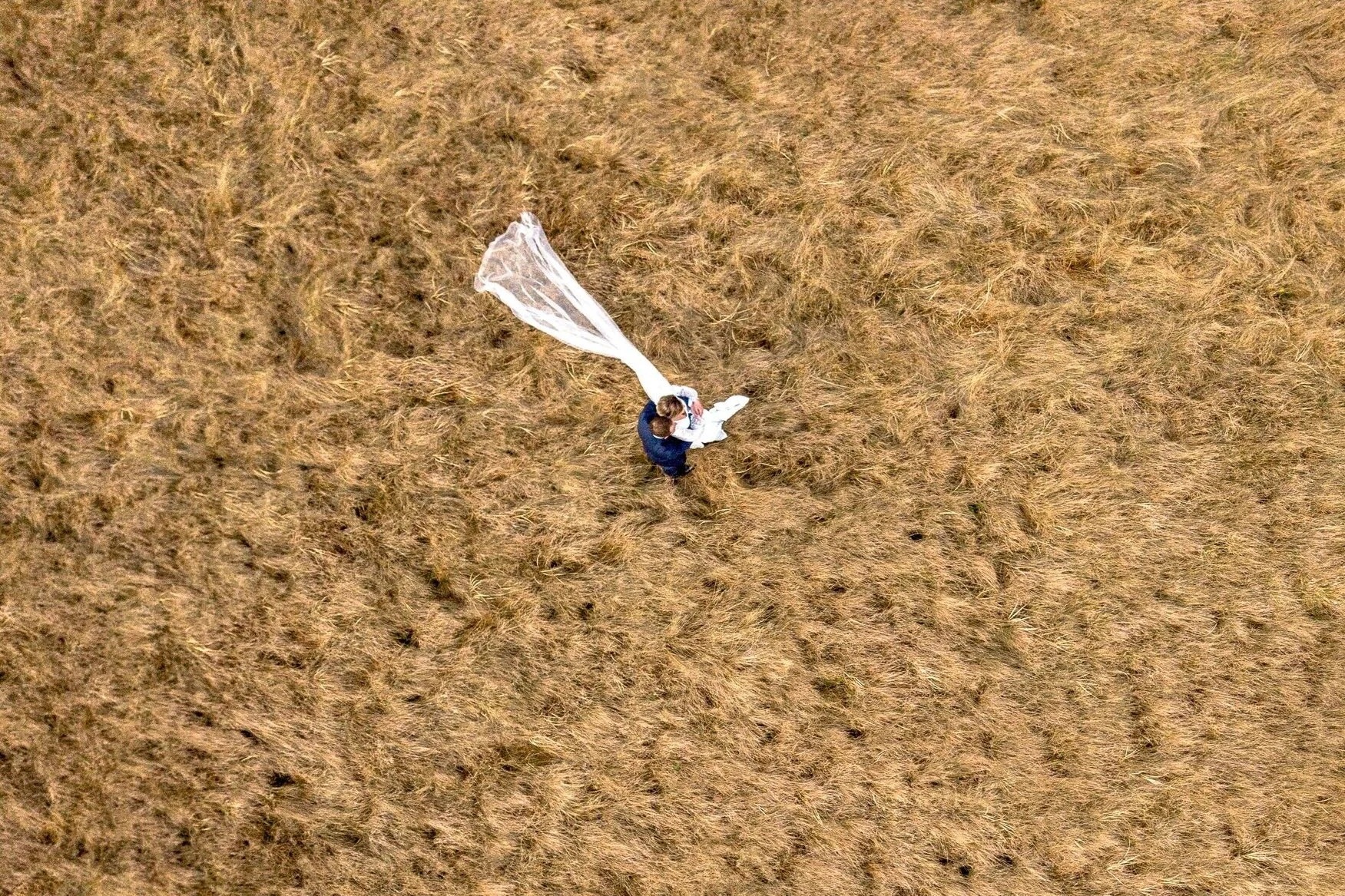 drone%2Bshot%2Bof%2Bmarried%2Bcouple%2Bwith%2Bdress%2Bflapping