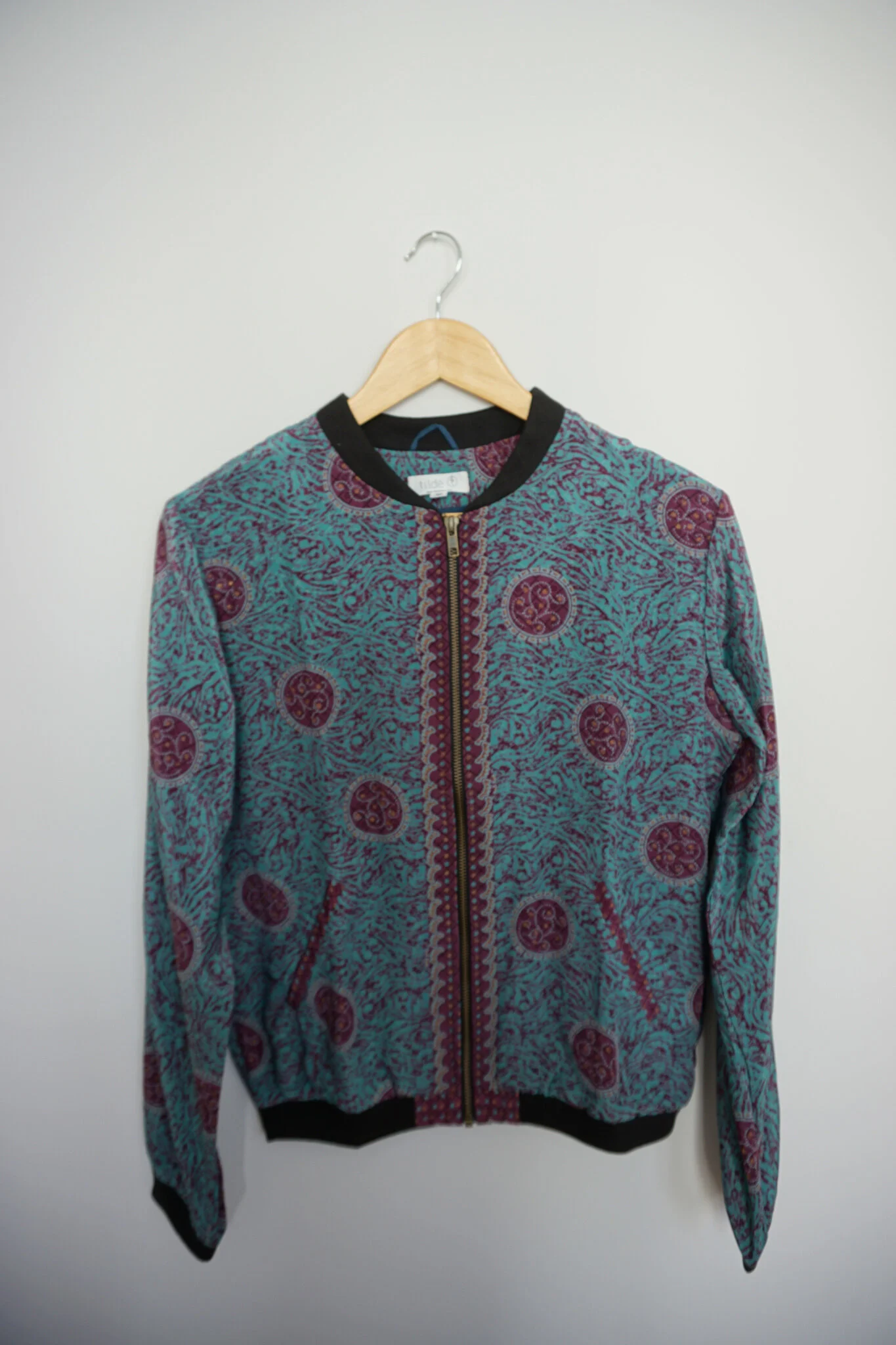 turquoise bomber jacket