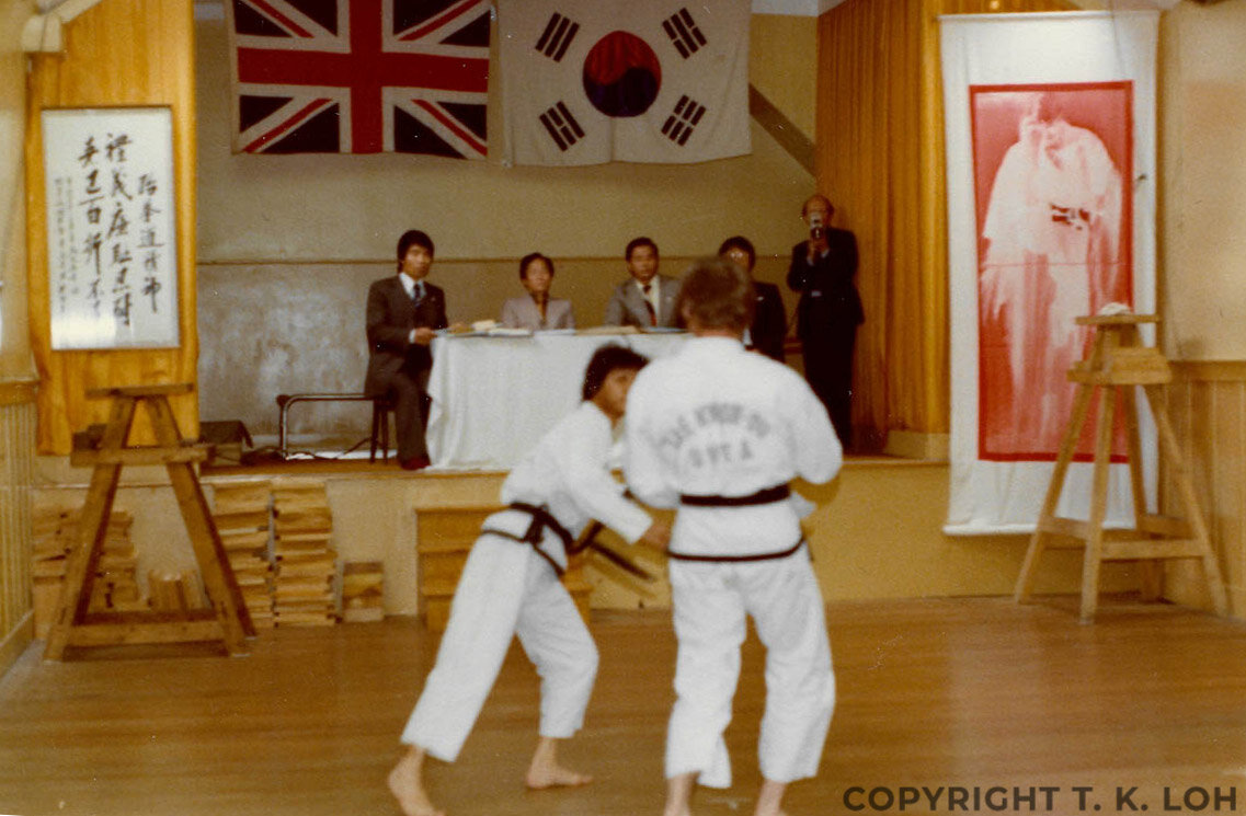Sparring with Alan Leach (army officer from Bolton) at my 3rd Dan grading examined by Gen Choi, Gm Kim Jong Chan, Gm Lim Won Sup and FGm Rhee