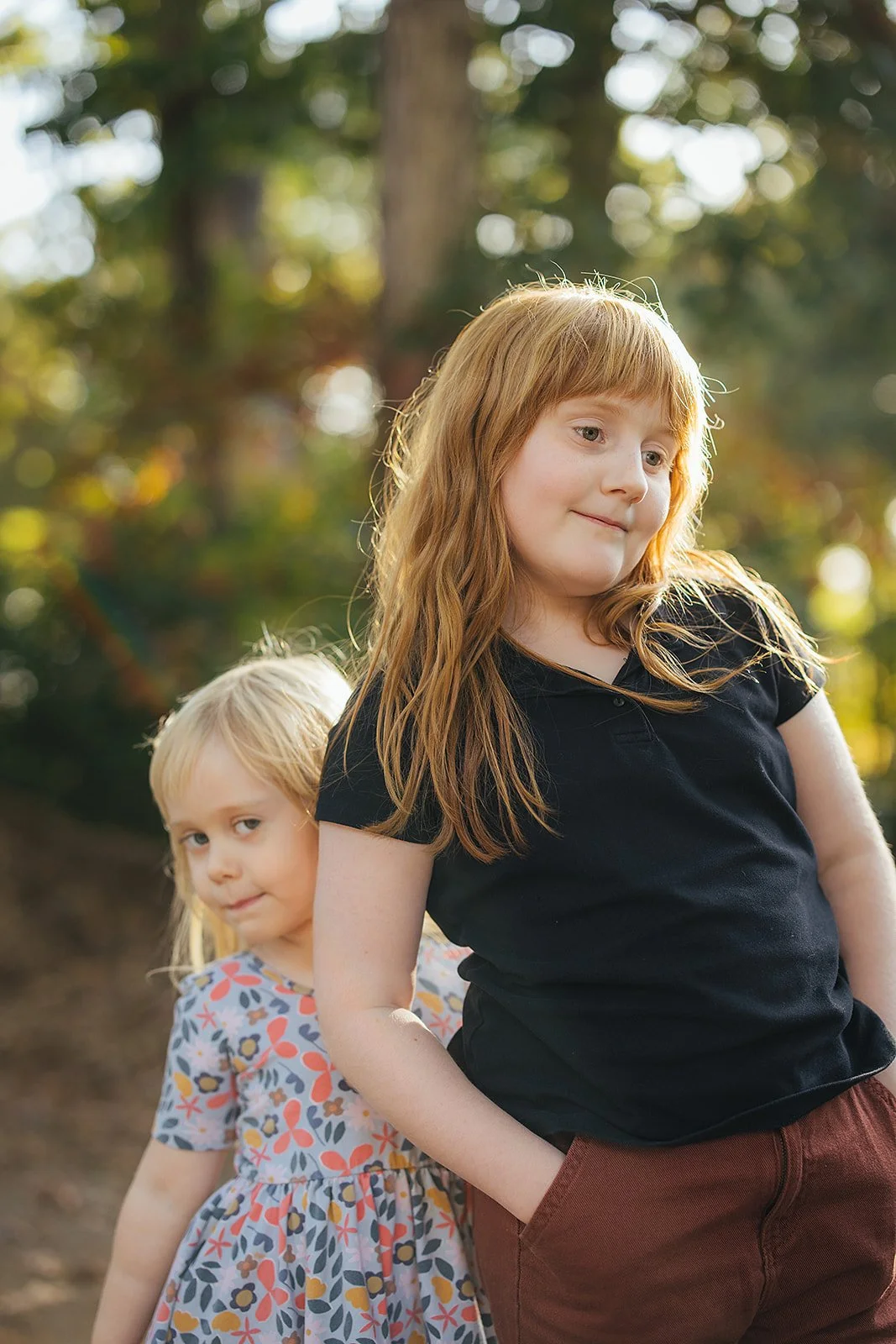 Siblings Standing Together Outside During Family Photo Session