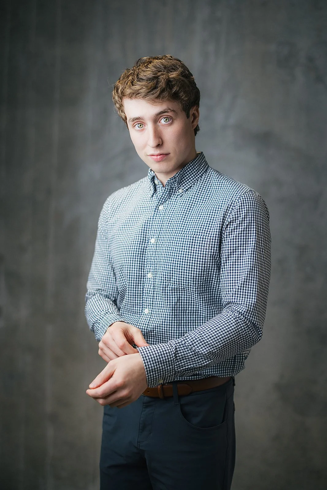 Young Employee Smiling During Professional Headshot