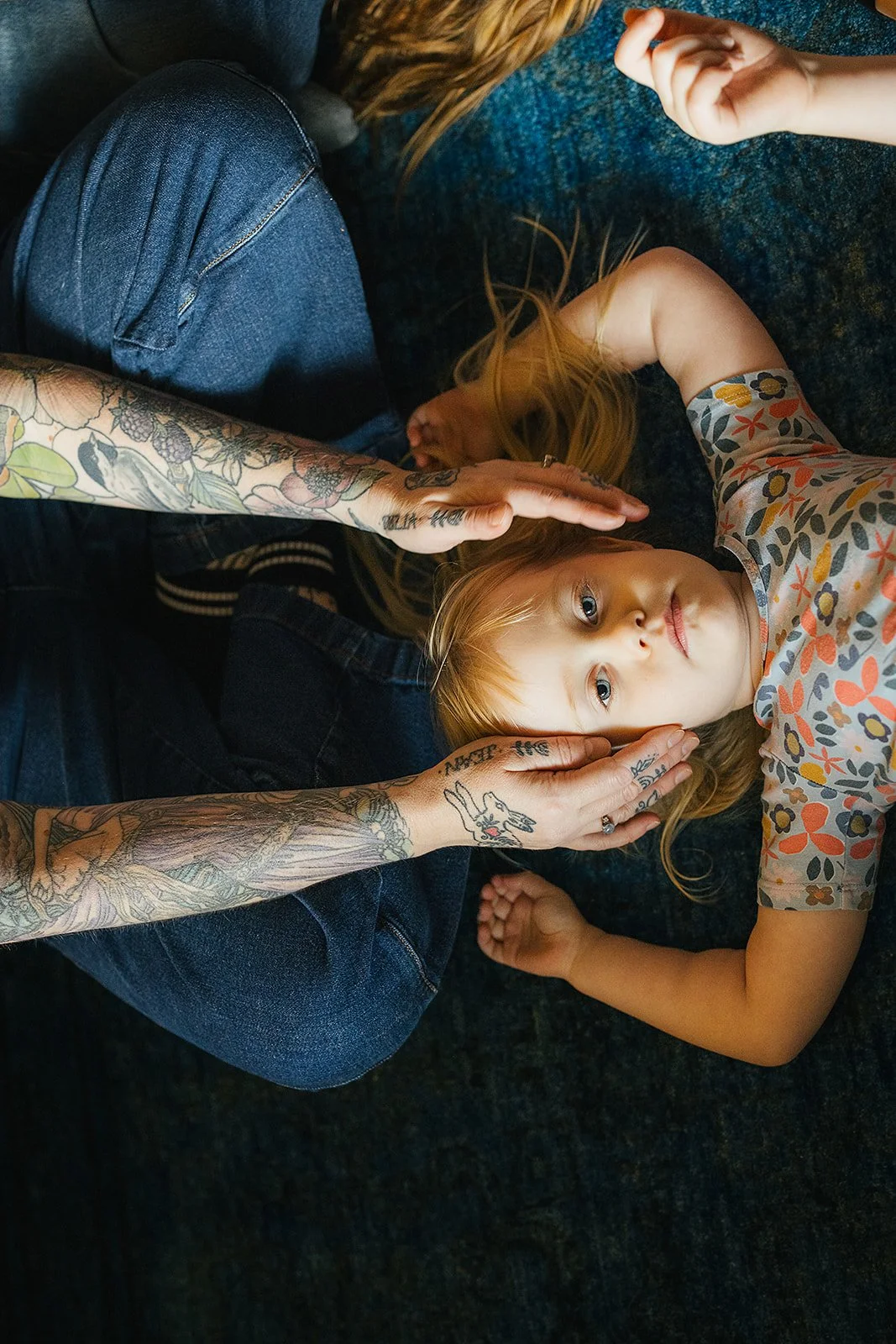 Young Girl Laying Down During Family Photo Session