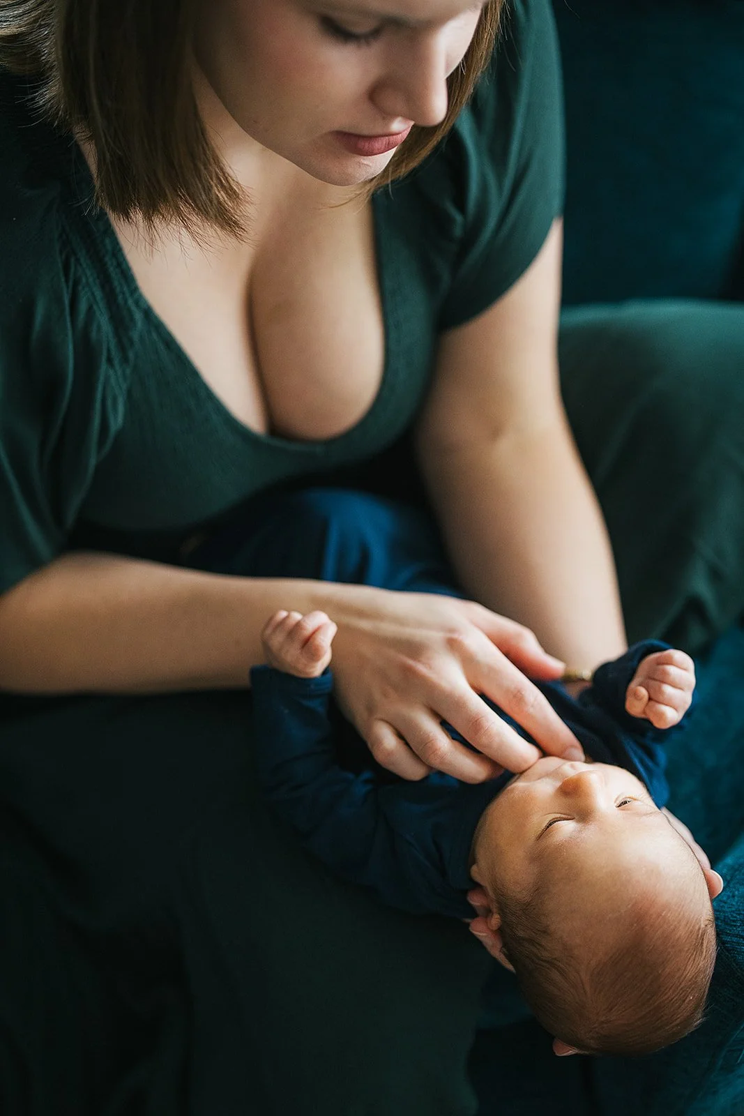 Mother looks fondly at her newborn baby during a photoshoot in Durham, NC